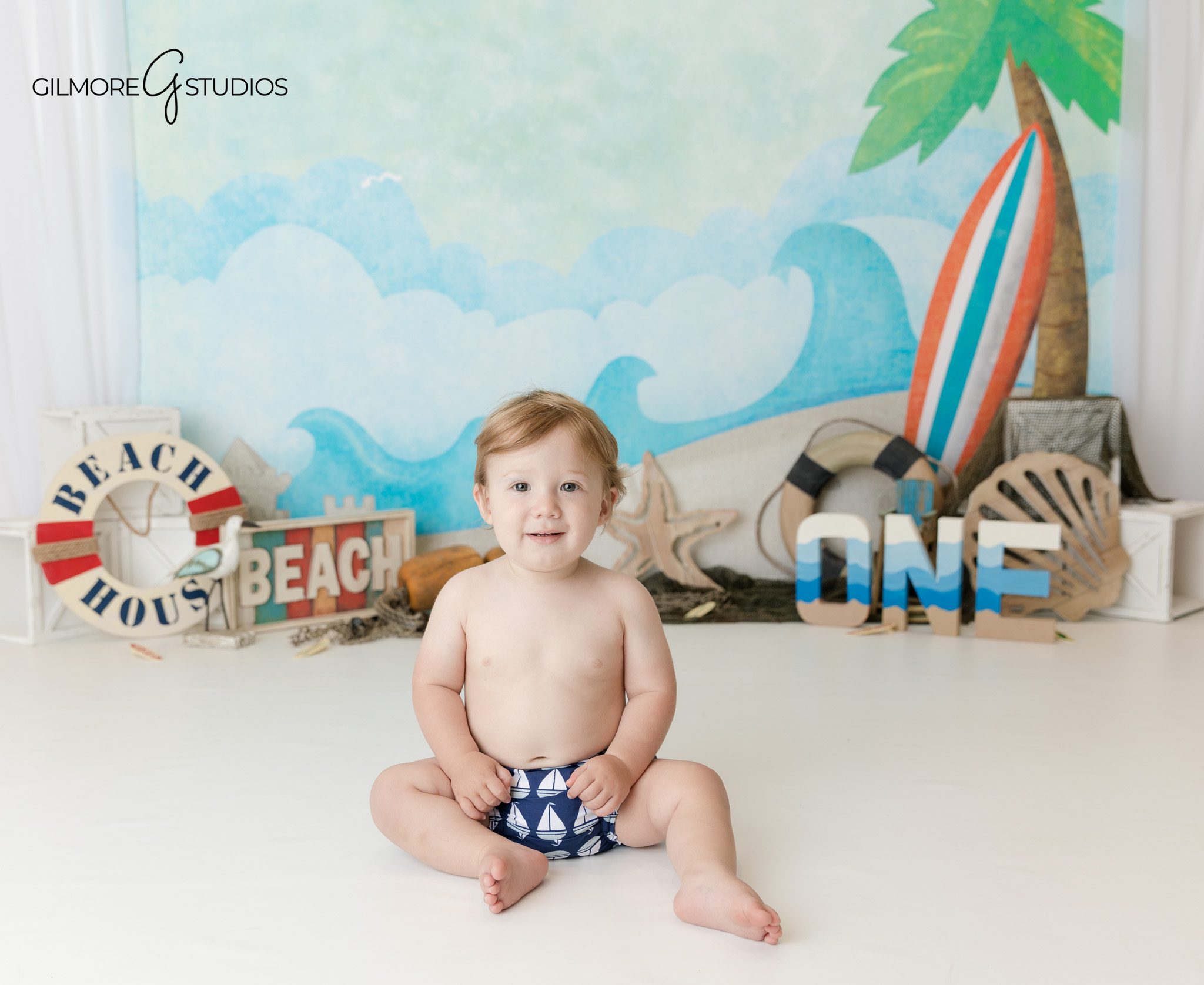 Baby milestone birthday portraits with ocean inspired colors Orange County
Indoor coastal themed baby photography session Orange County