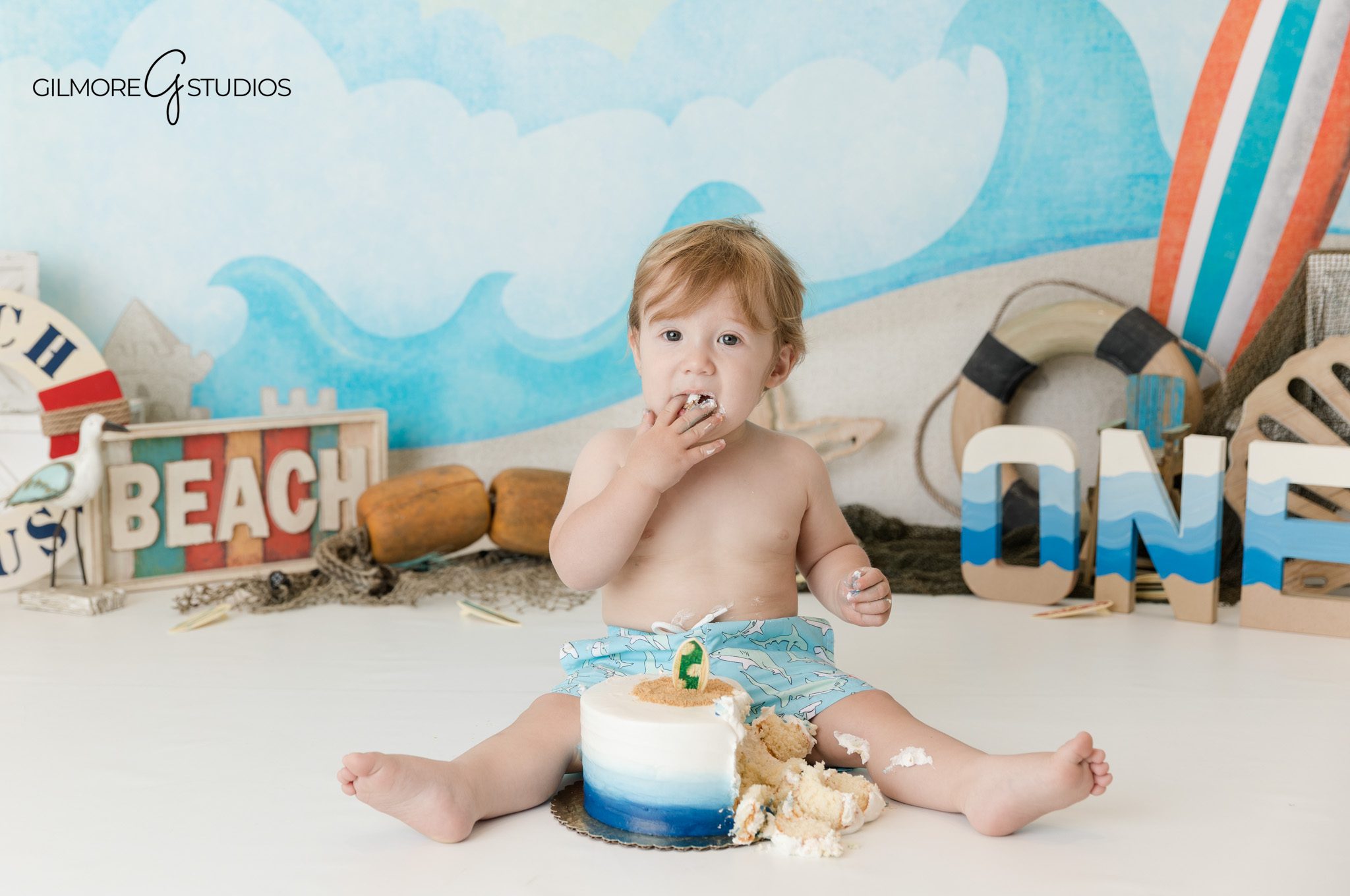First birthday milestone photography capturing joyful baby portraits Orange County
Baby cake smash with beach theme decor Orange County studio