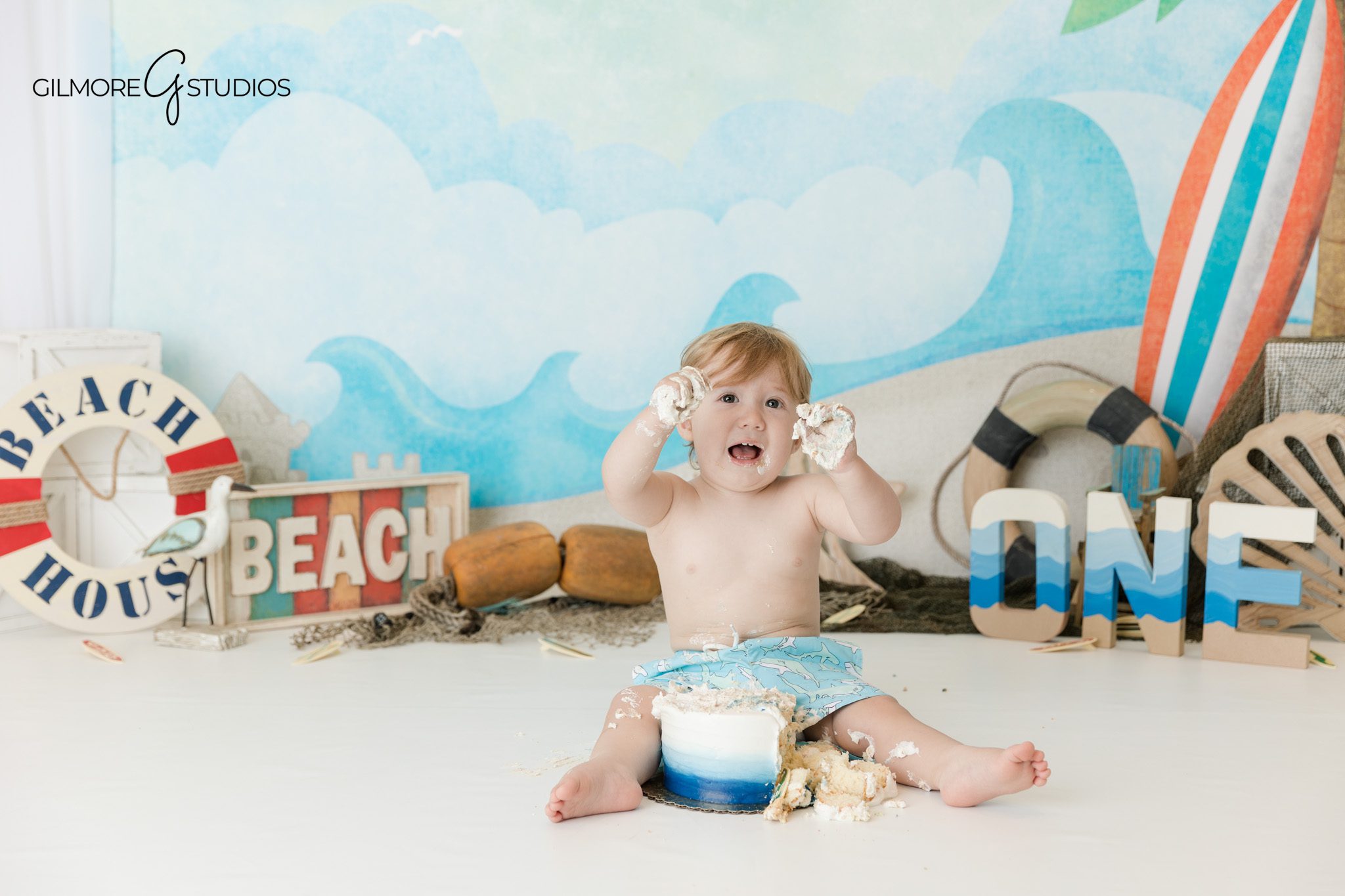 First birthday photography in Orange County featuring beach themed milestone portraits in studio
Baby cake smash photography with coastal decor in Orange County studio
