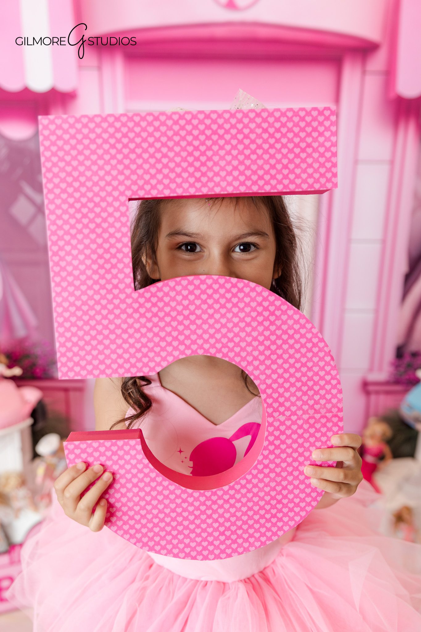 Girls birthday photoshoot portrait featuring Barbie theme and playful poses

Barbie inspired birthday photography portrait for confident 5 year old girl