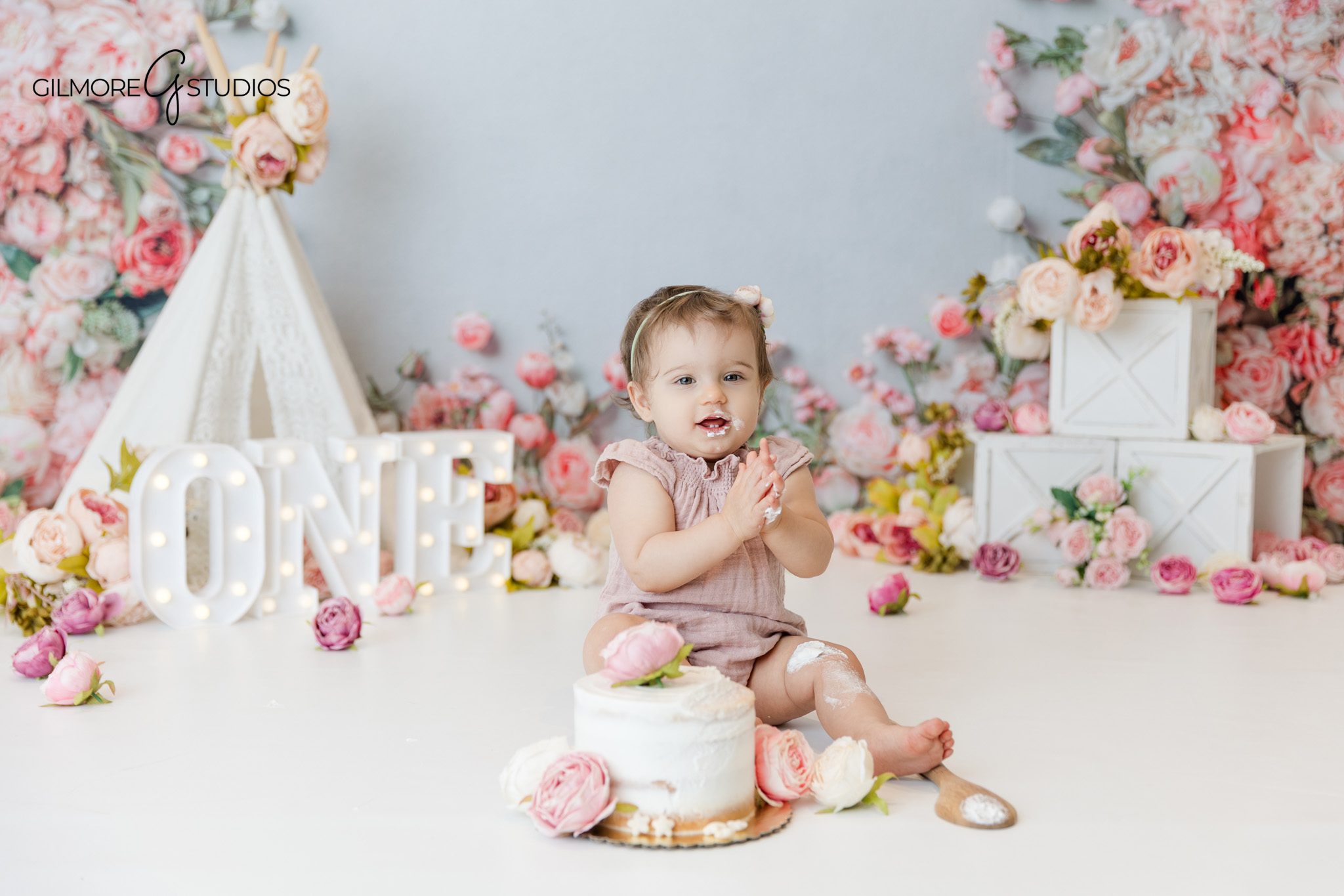 Floral cake smash portrait by Phoenix cake smash photographer
First birthday floral cake smash photography in Phoenix AZ studio