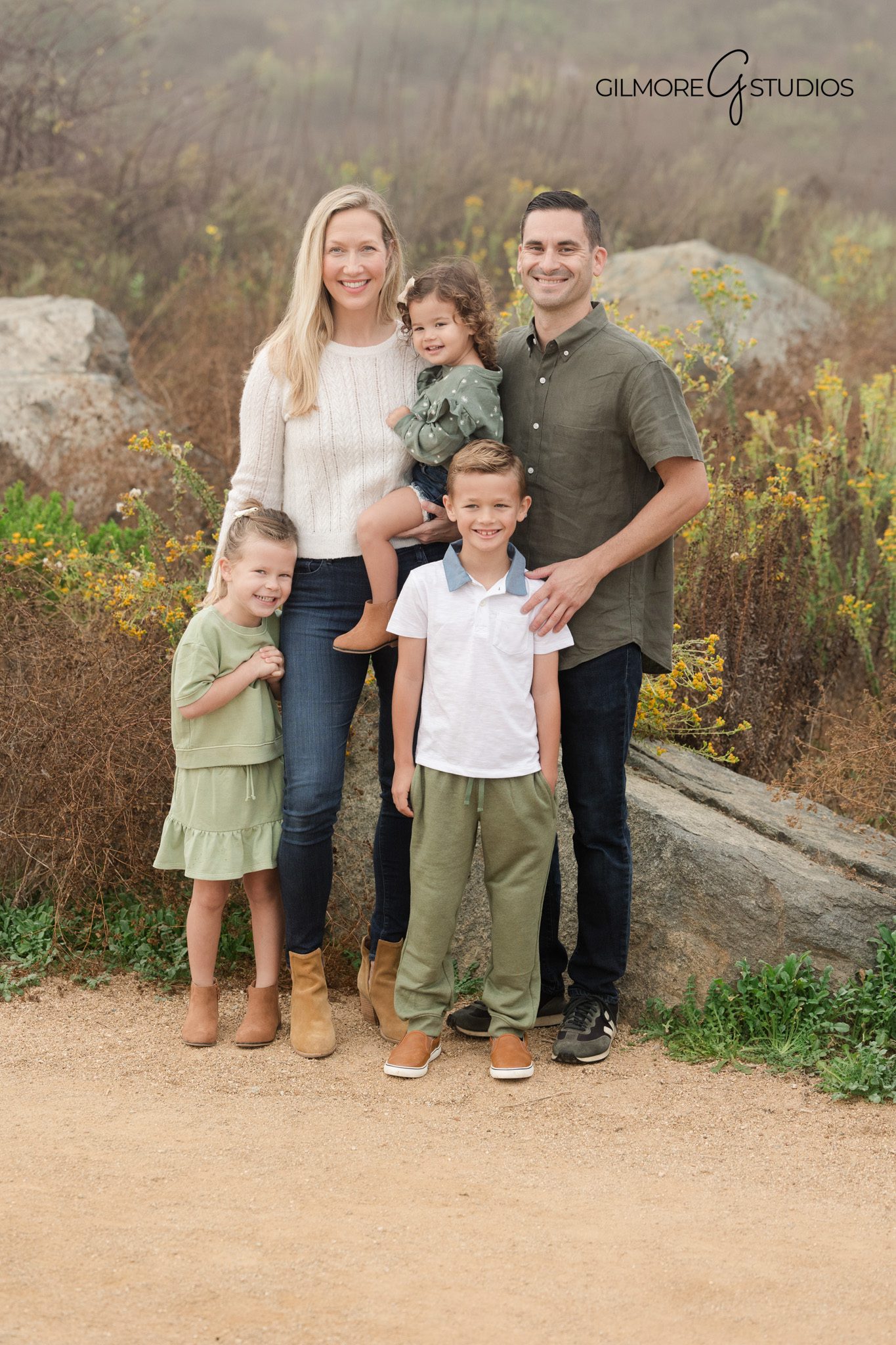 Lifestyle family photography session at Back Bay trails

Family hugging during Back Bay Newport Beach photo shoot