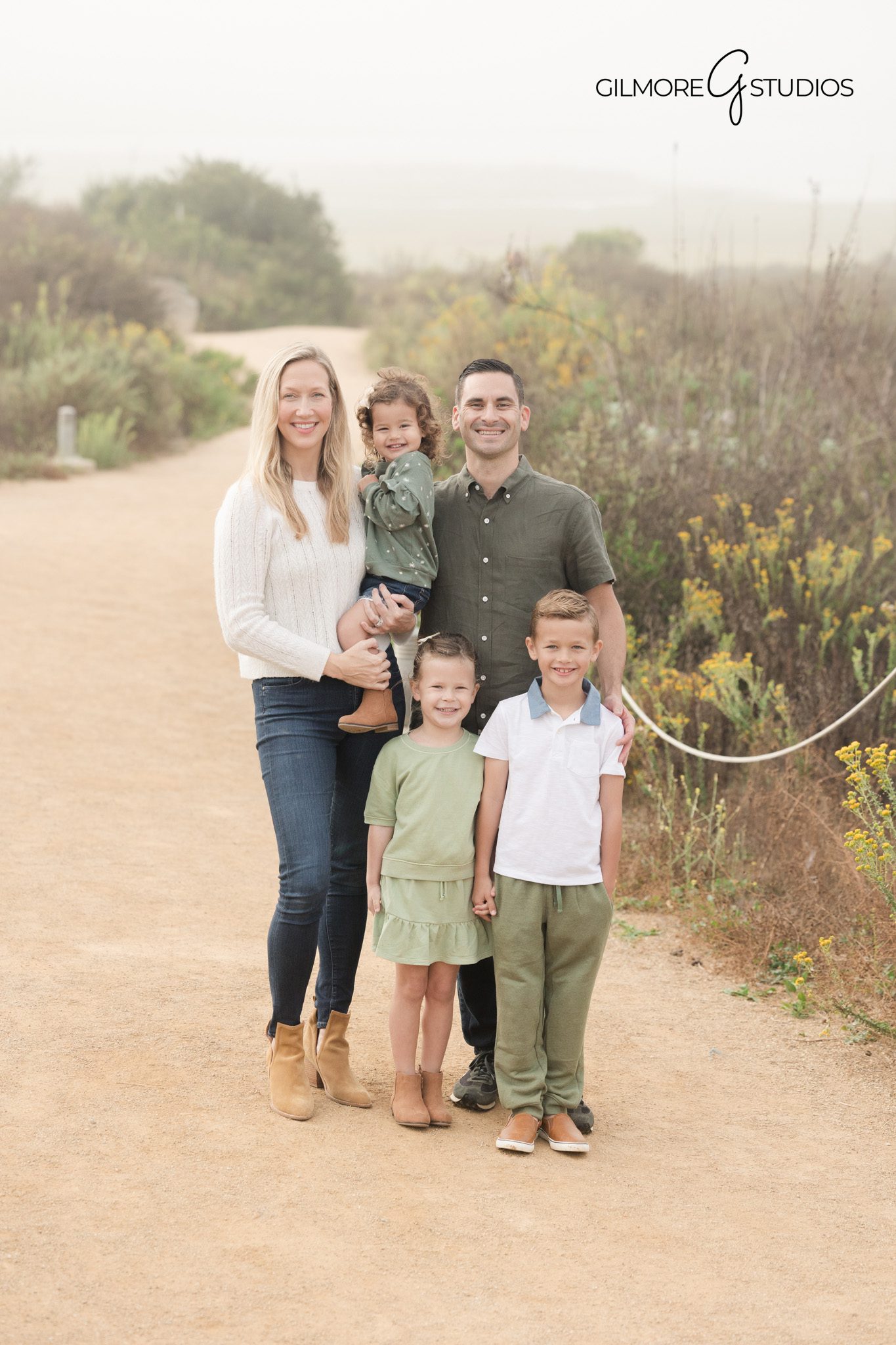 Genuine smiles during family portraits

Relaxed family posing outdoors