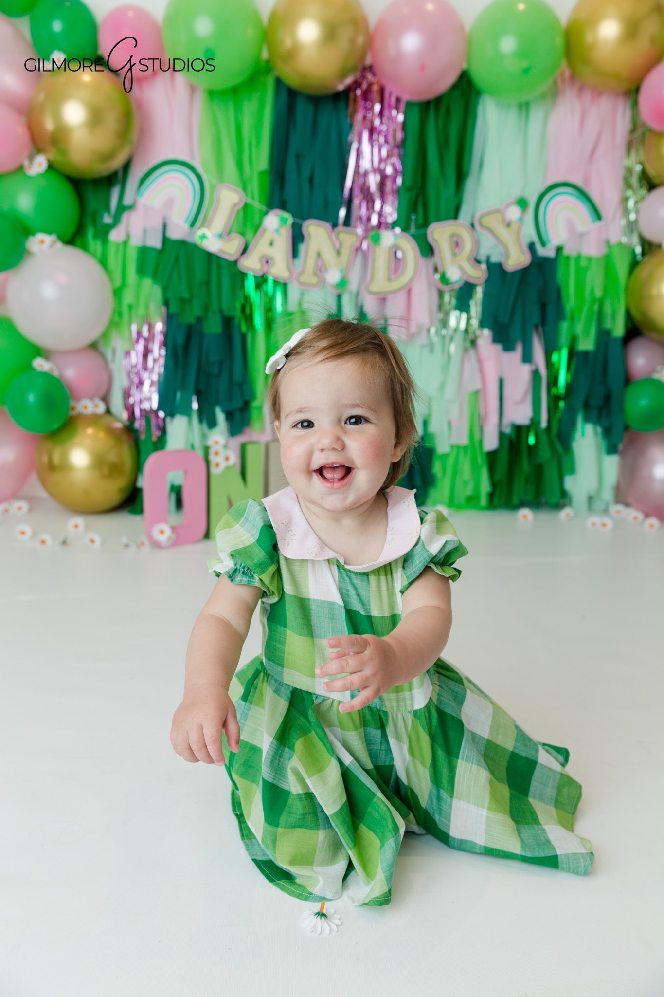 baby milestone photographer cake smash session indoor studio portrait
first birthday photography cake smash baby exploring cake portrait