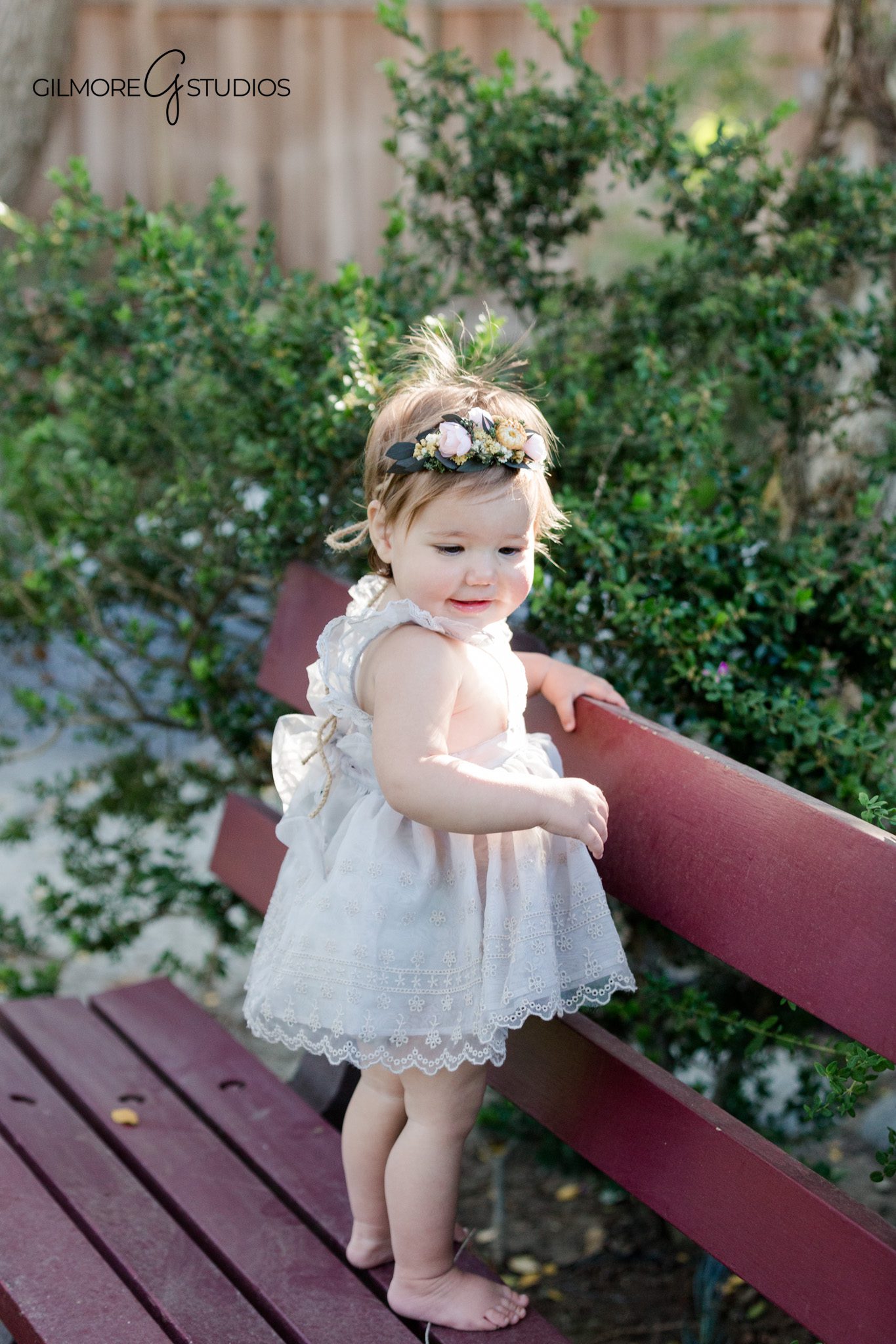 first birthday portrait photography baby playing with cake frosting
baby photography cake smash portrait with balloons and backdrop