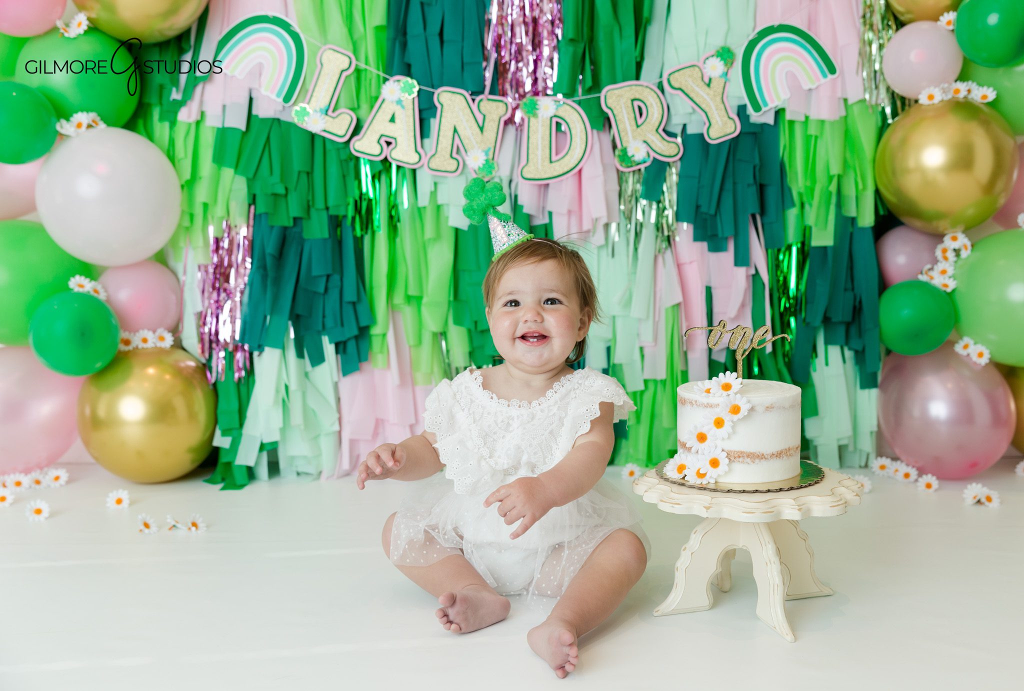 cake smash photographer first birthday baby portrait session indoors
first birthday cake smash photography baby girl studio portrait