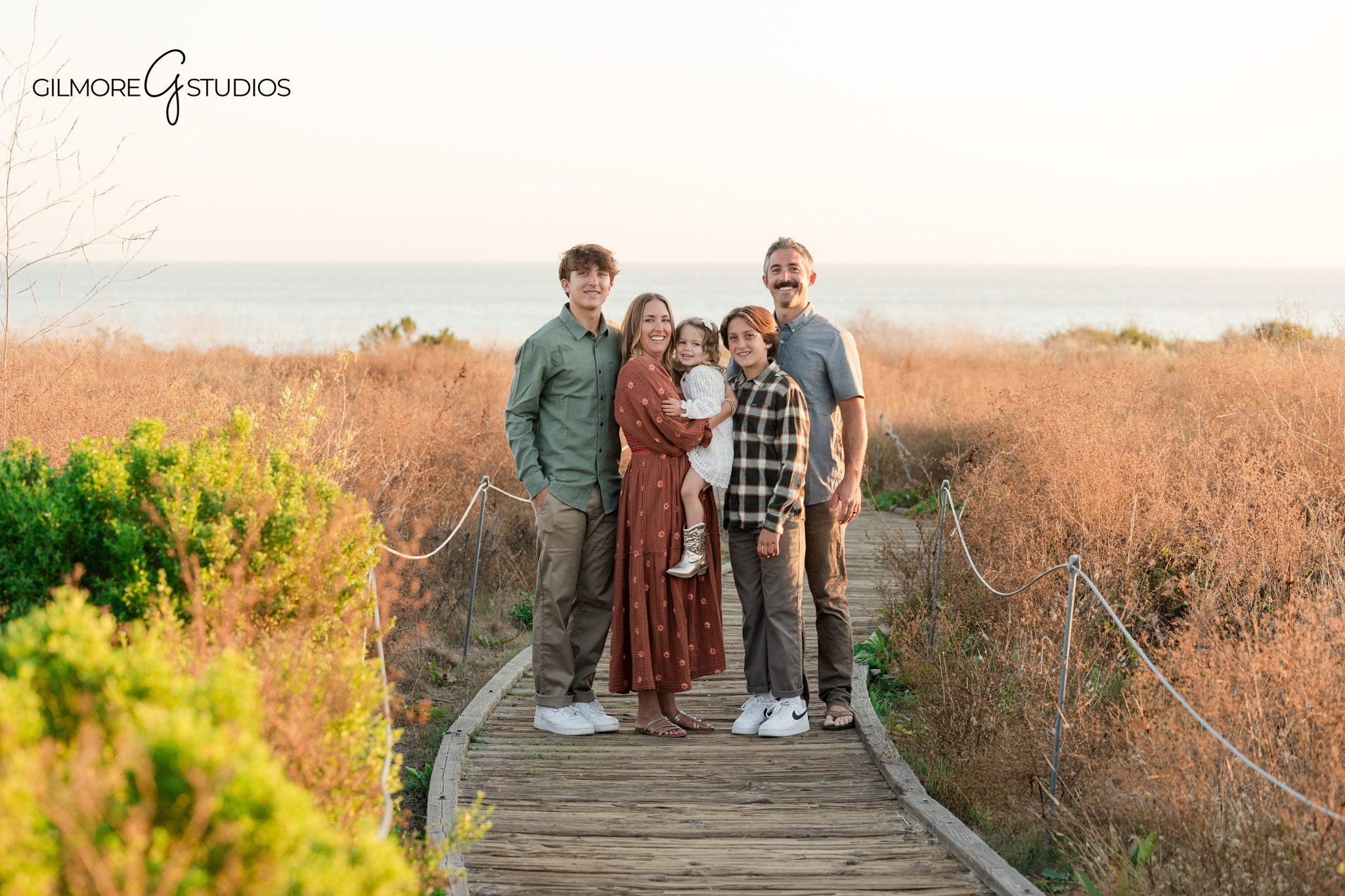 Family portrait photography along coastal trail

Crystal Cove family photography capturing relaxed moment
