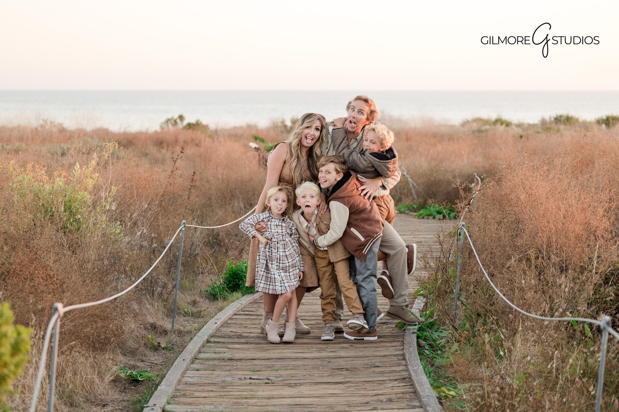 family portrait photography Crystal Cove sunset session
Newport Beach family photography kids interacting beach portrait