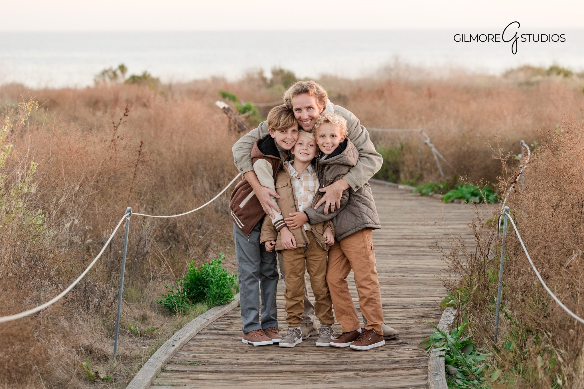 Crystal Cove family photography session kids playing beach portrait
Newport Beach family photography sunset beach candid portrait