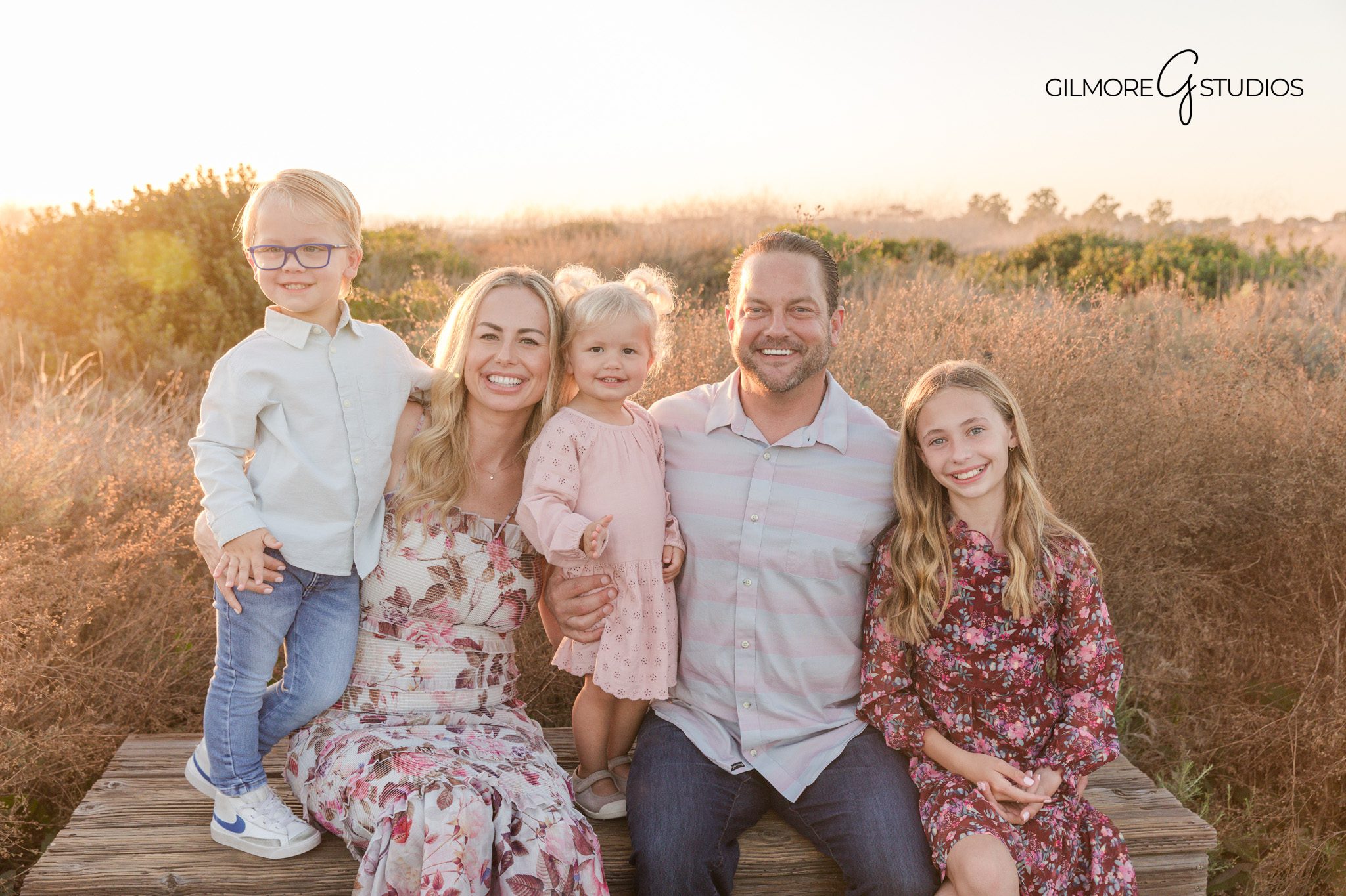 Newport Beach family portrait session near coastal trail

Family photography capturing natural interaction between siblings