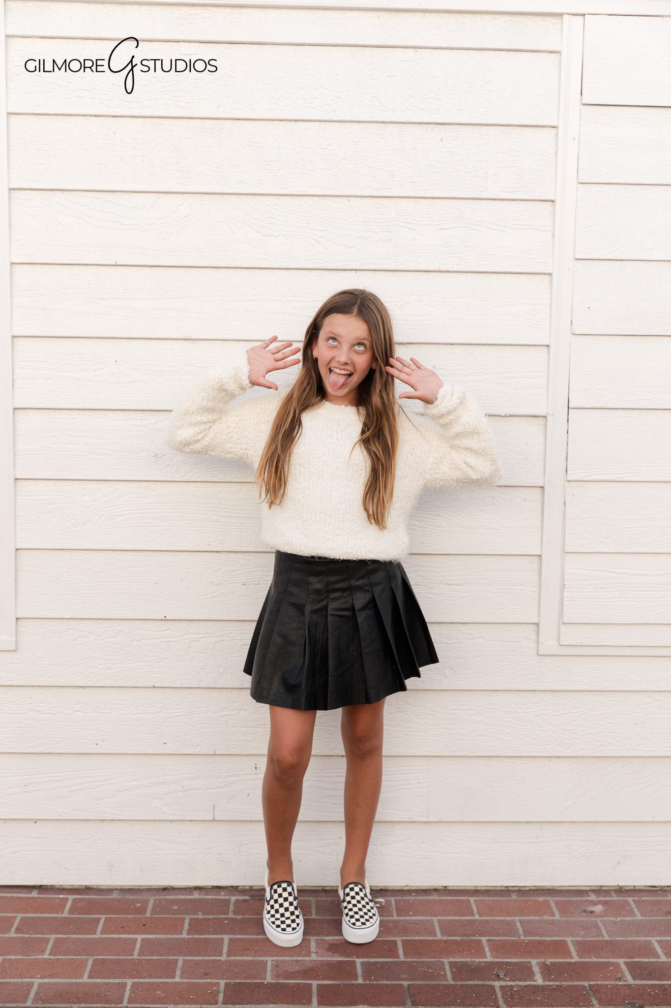 Newport Beach family portrait session with coastal scenery

Beach portrait photography showing family walking together