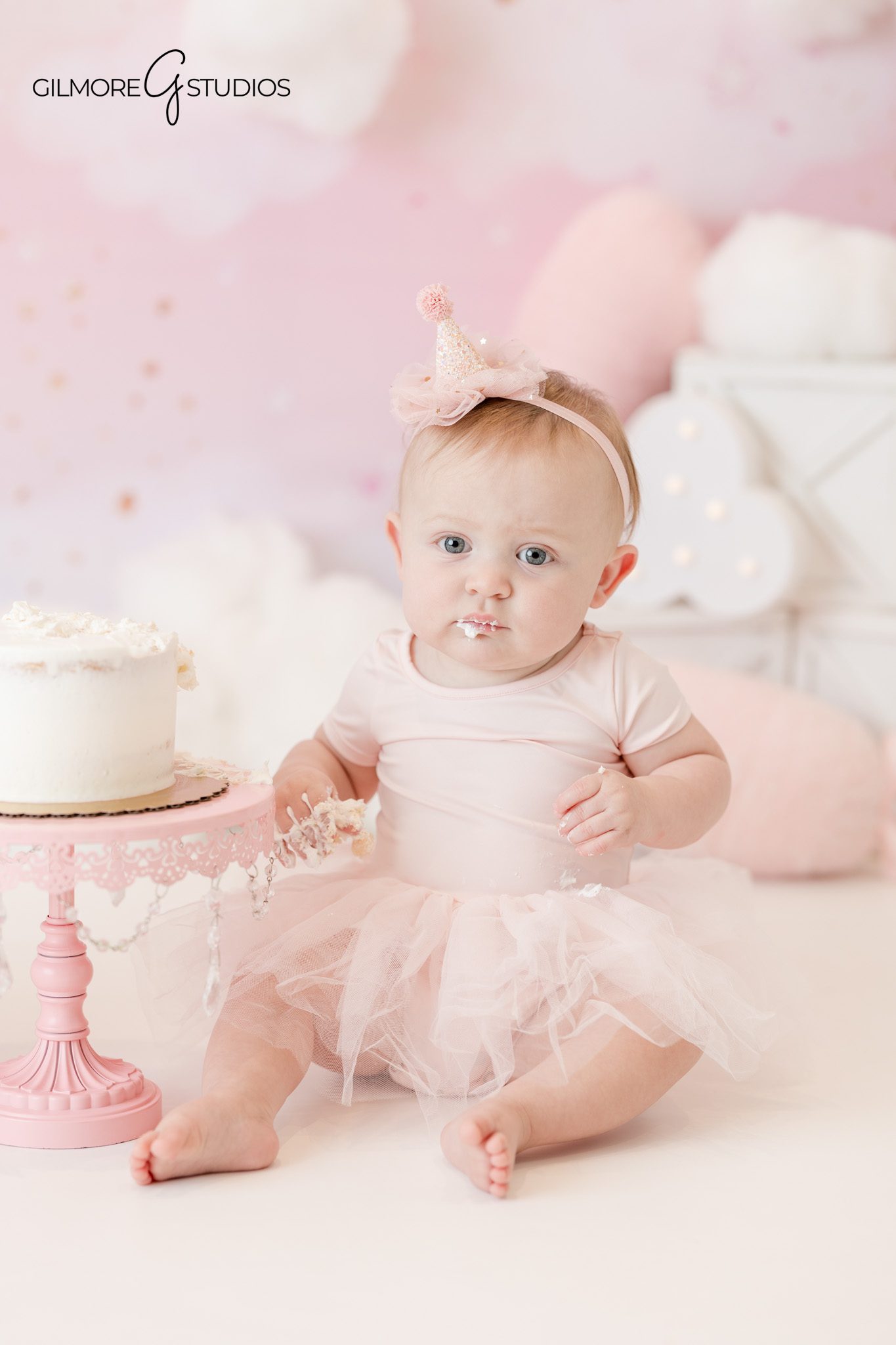 First birthday portrait photography of baby sitting

Baby portrait photography capturing playful expression