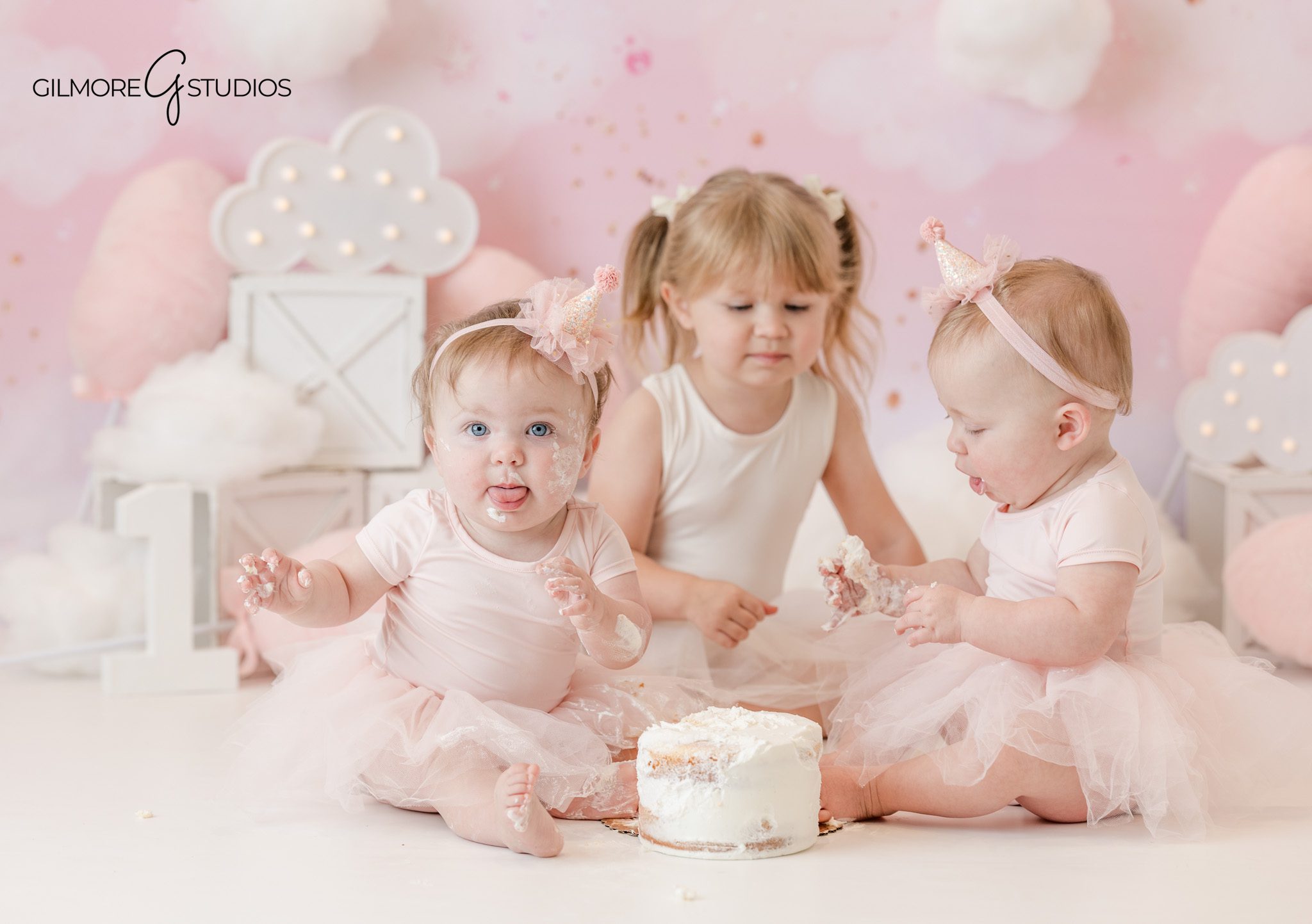 Cake smash photography portrait of baby exploring frosting

Baby portrait session photographed by milestone photographer