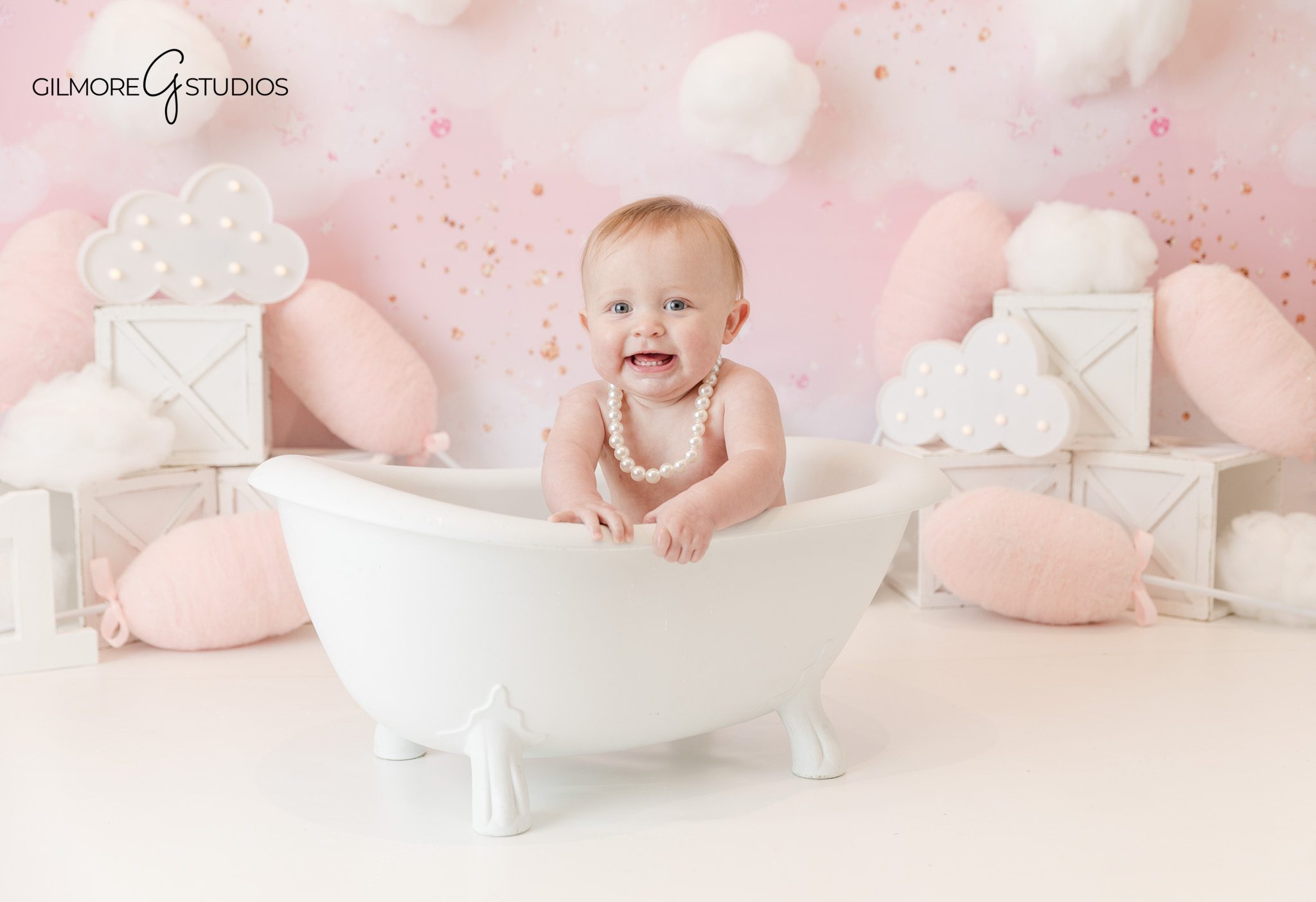 Professional baby photographer capturing birthday milestone portrait

Baby portrait photography with cake smash moment