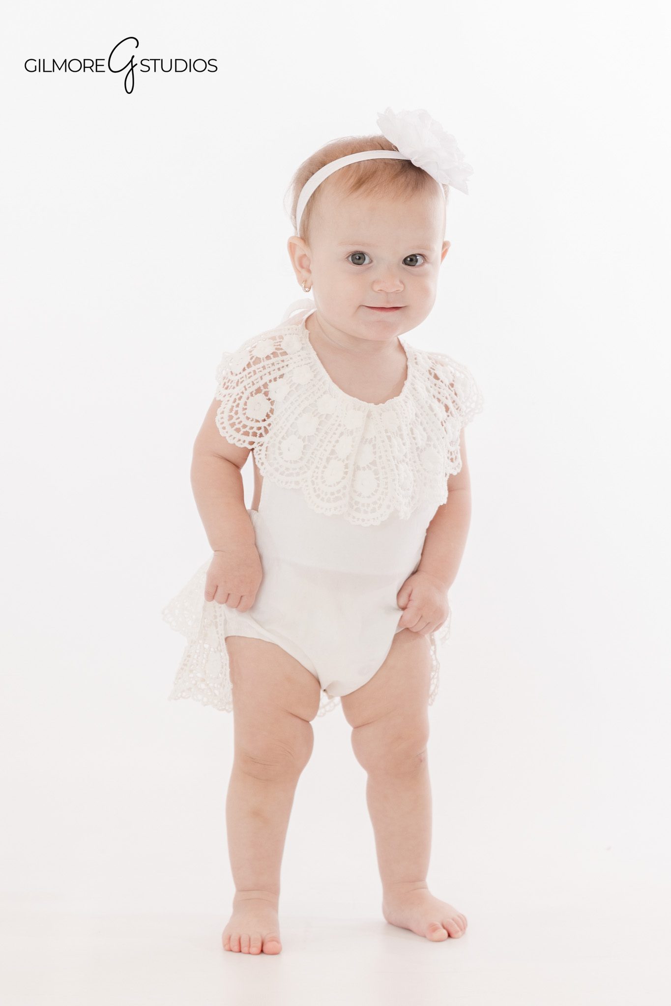 Cake smash portrait photography with baby and birthday cake

Baby milestone photography portrait showing joyful expression