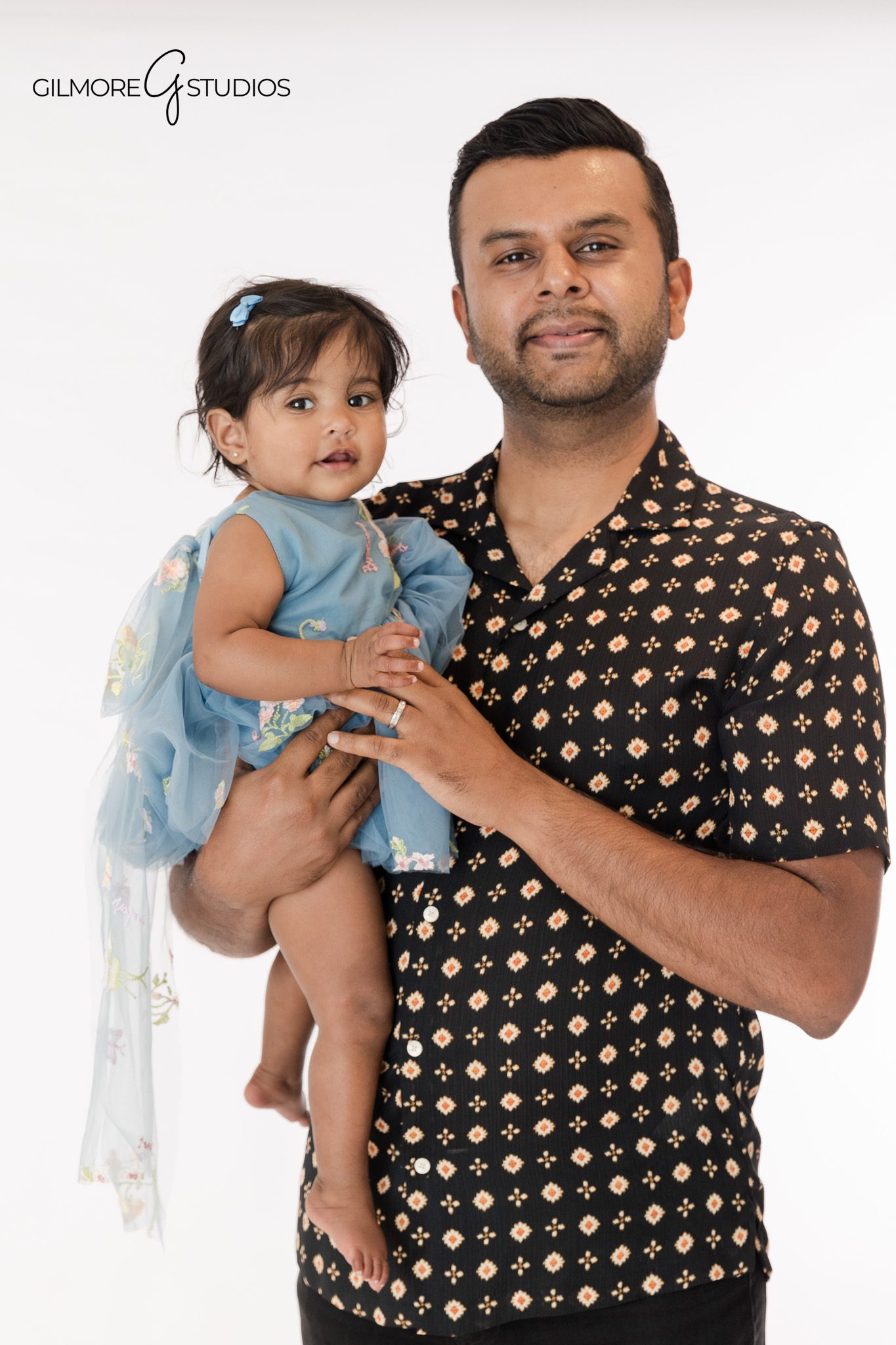 Professional baby photographer capturing cake smash portrait
Baby milestone photography showing first birthday portrait