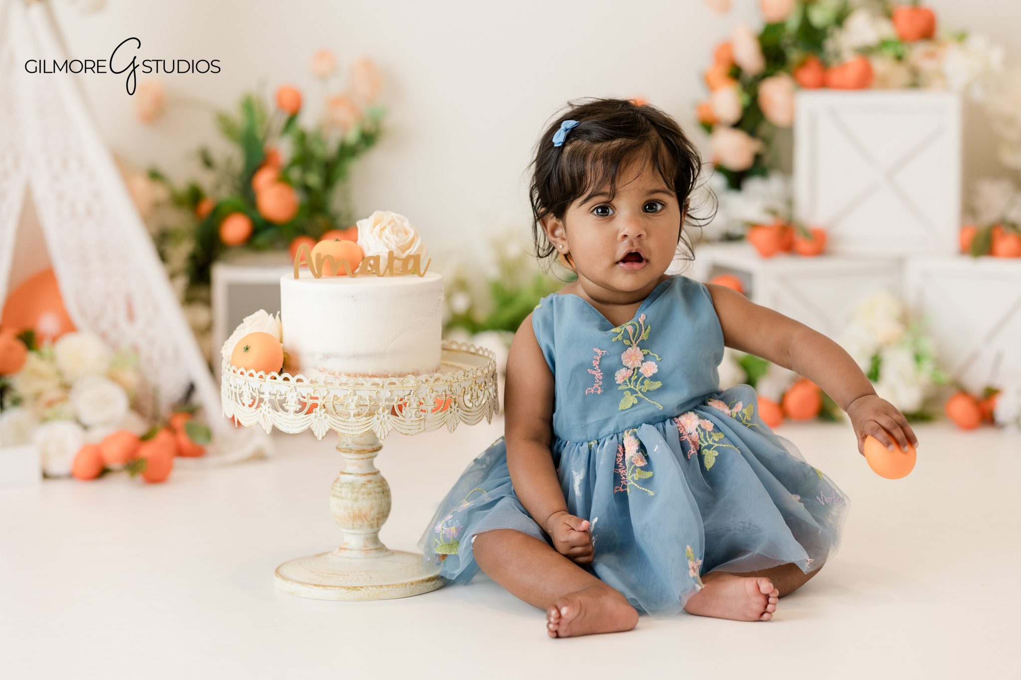 Cake smash photography portrait of baby exploring frosting
Baby portrait session photographed by milestone photographer