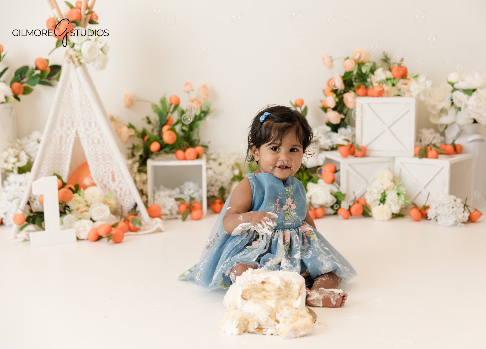 Cake smash photography portrait showing baby interaction
Baby portrait photography with playful birthday theme