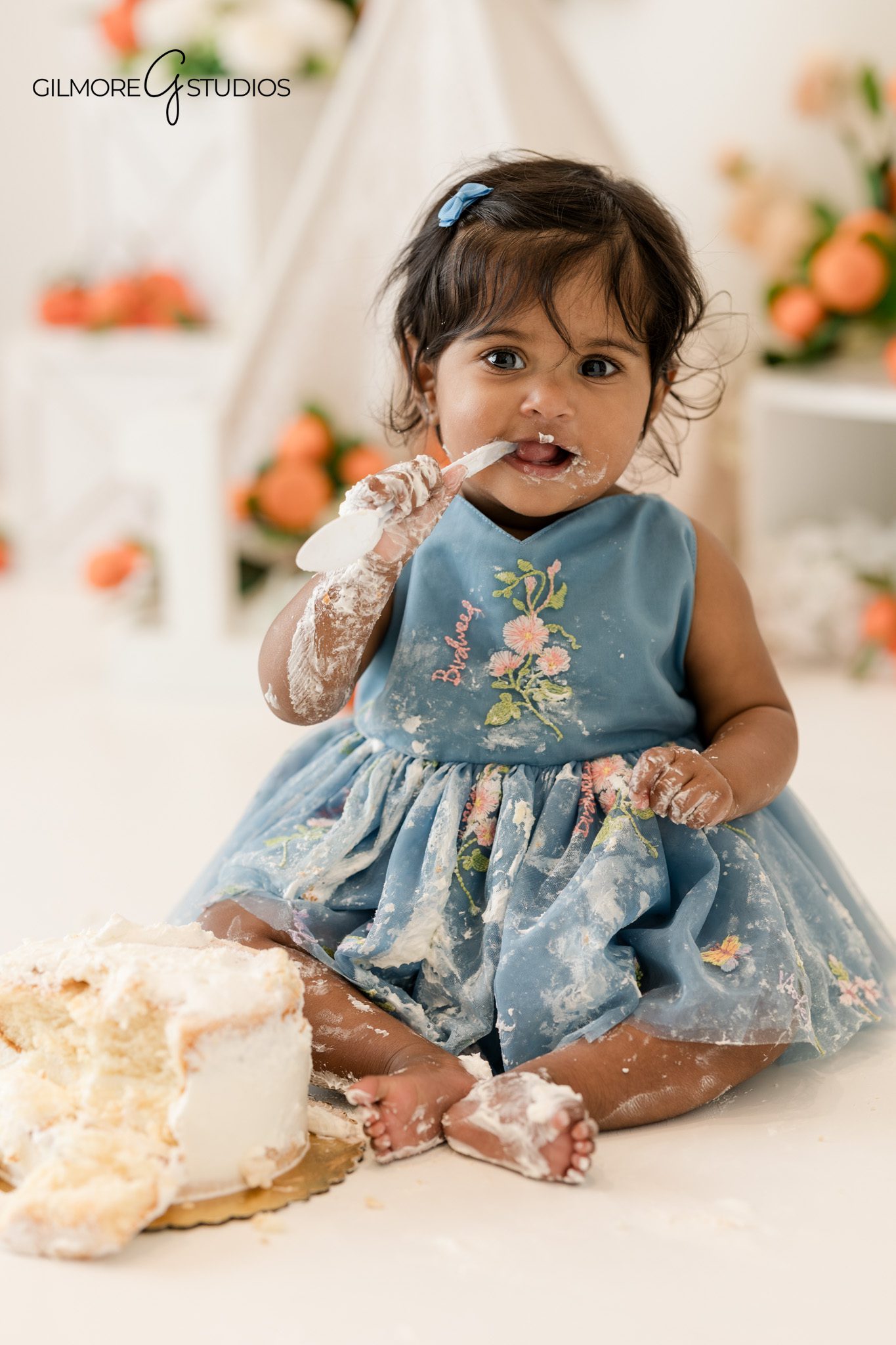 Professional baby photographer capturing birthday milestone portrait
Baby portrait photography with cake smash moment