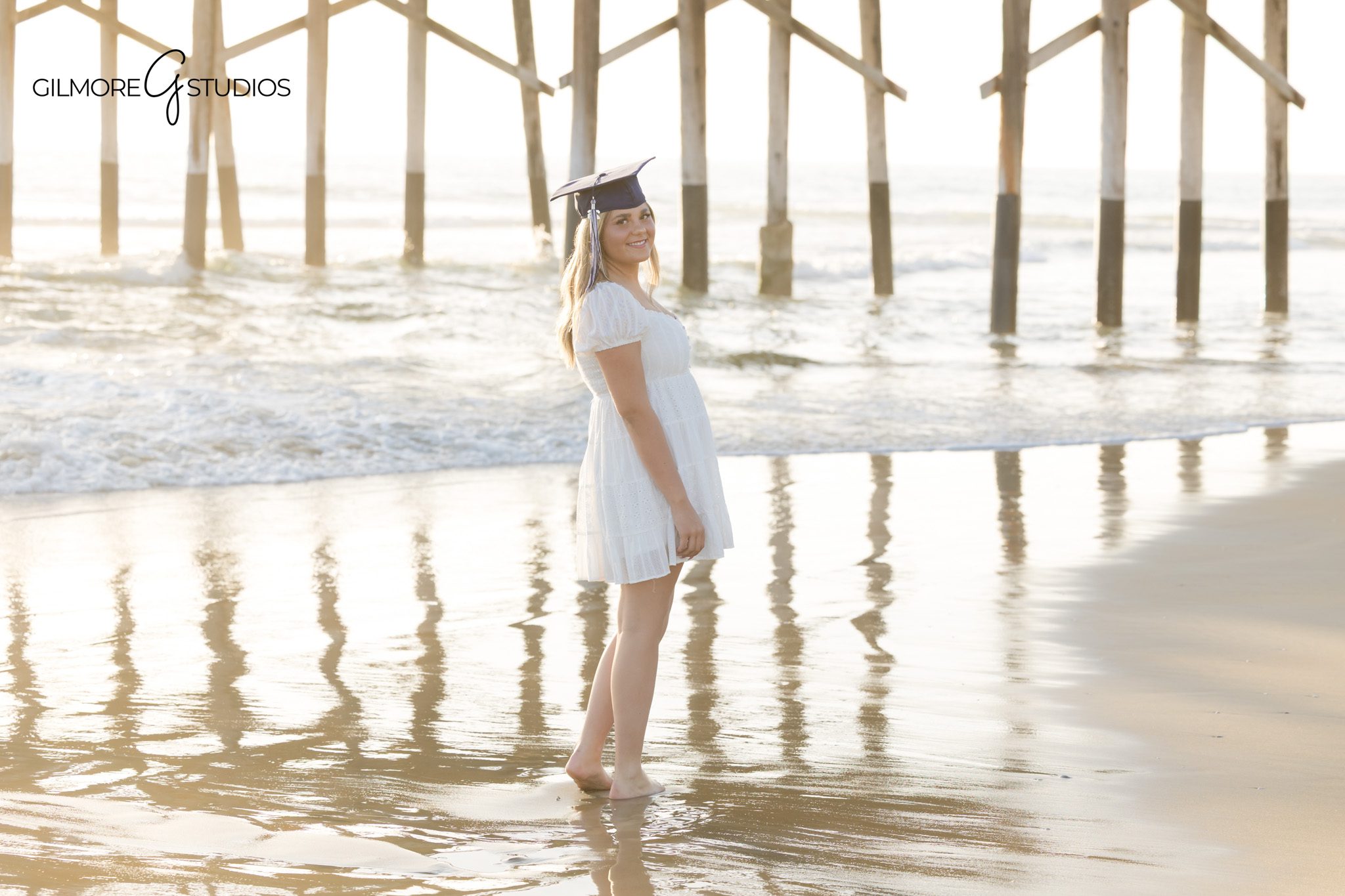 Newport Beach senior photographer capturing beach portrait at sunset
senior portrait photography Newport Beach beach near pier session