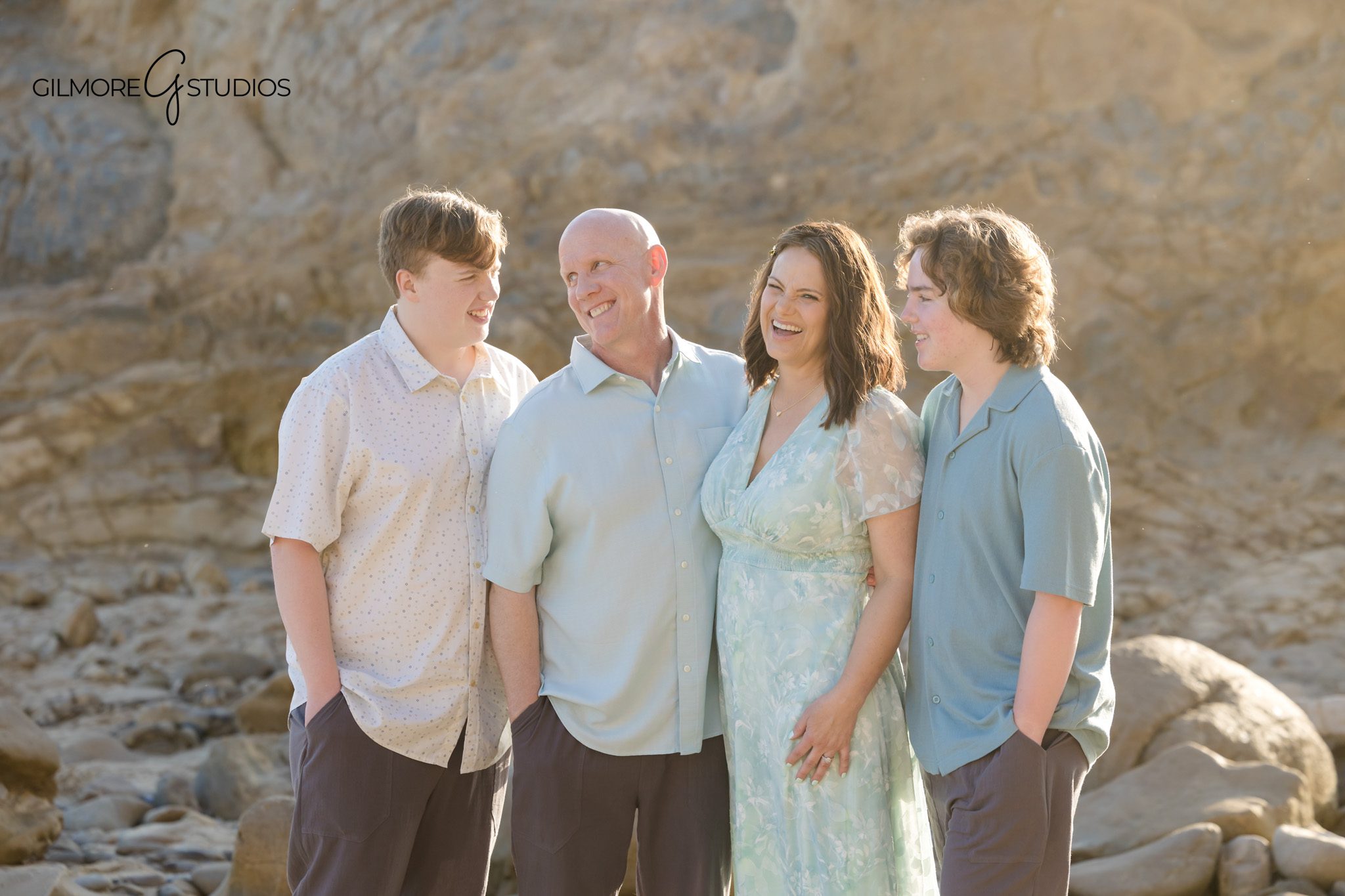 Orange County engagement photographer with kids beach portrait session
Newport Beach portrait photography family walking along shoreline