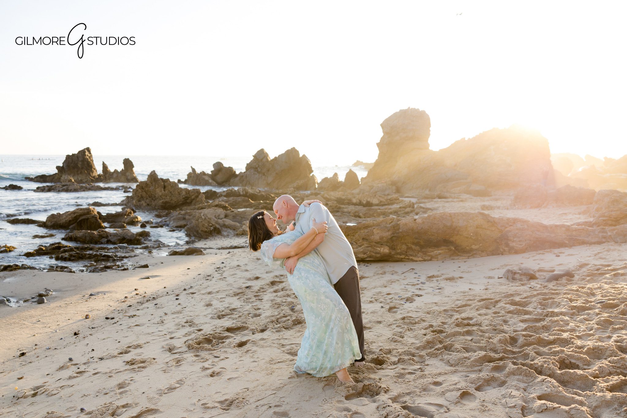 beach portrait photographer Newport Beach family sunset session
engagement photographer capturing kids and parents candid moments