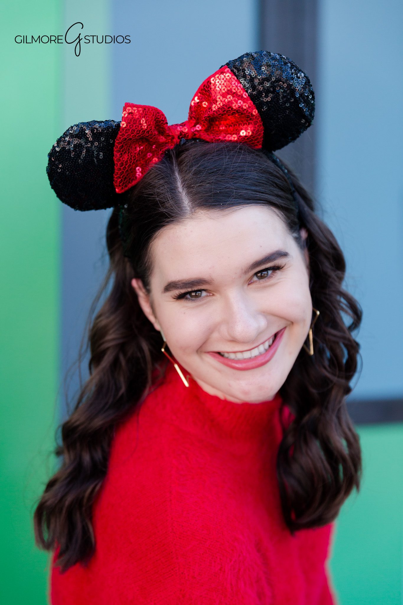 Senior posing near Cinderella Castle smiling
Disney senior photos walking down Main Street