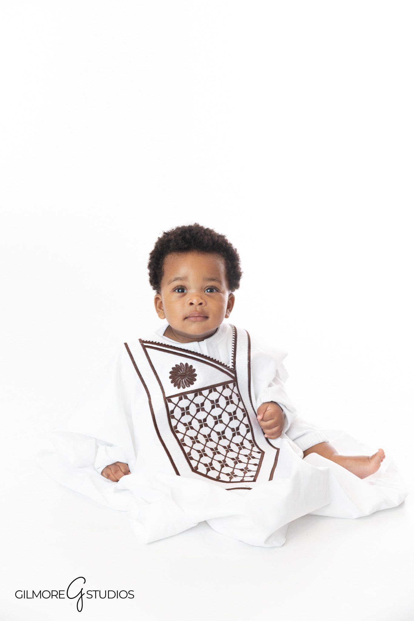 first birthday portrait photographer Newport Beach baby sitting clean white backdrop
Newport Beach portrait photography baby milestone session sitting pose studio