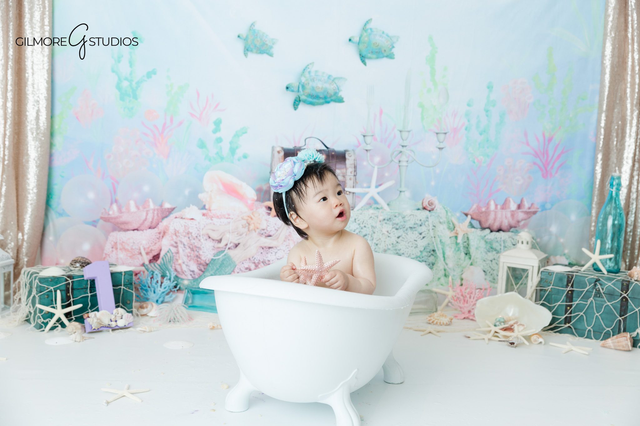 cake smash portrait baby girl with cake stand
newport beach cake smash photographer birthday session
