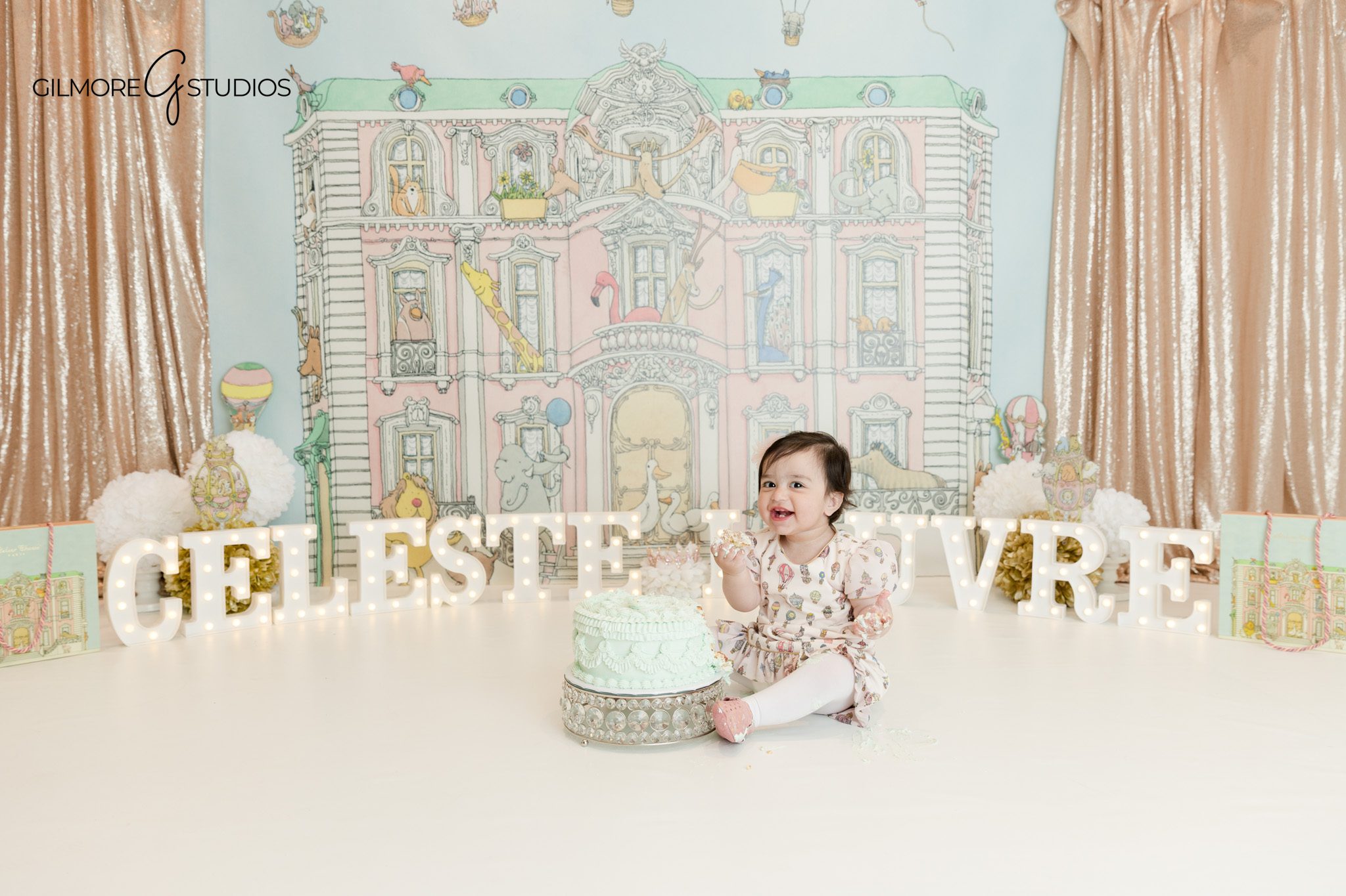 Baby girl laughing during cake smash photos Phoenix
Phoenix baby photographer cake smash portrait session