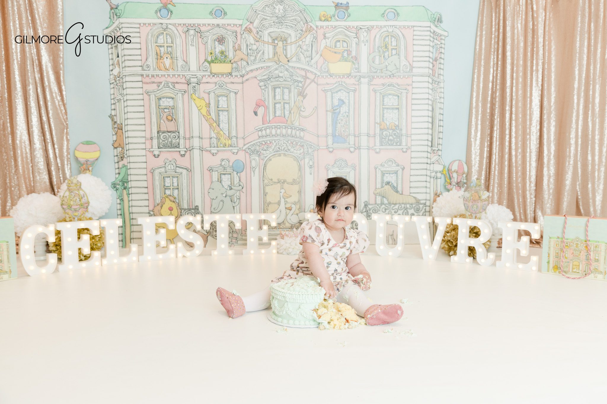 Baby girl sitting next to birthday cake Phoenix session
Phoenix cake smash studio baby milestone photography