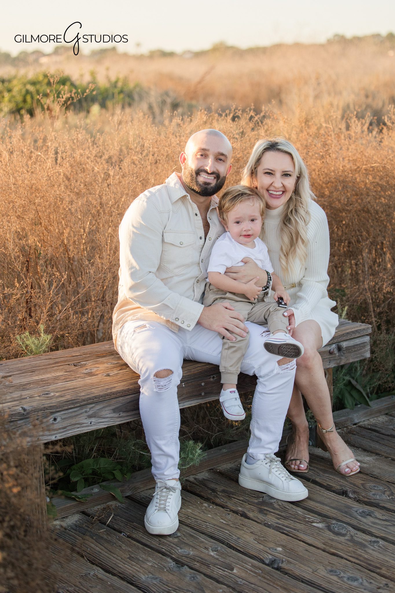 Crystal Cove family portrait photography mom dad and toddler golden hour
Newport Beach family photographer candid portrait child holding toy photography