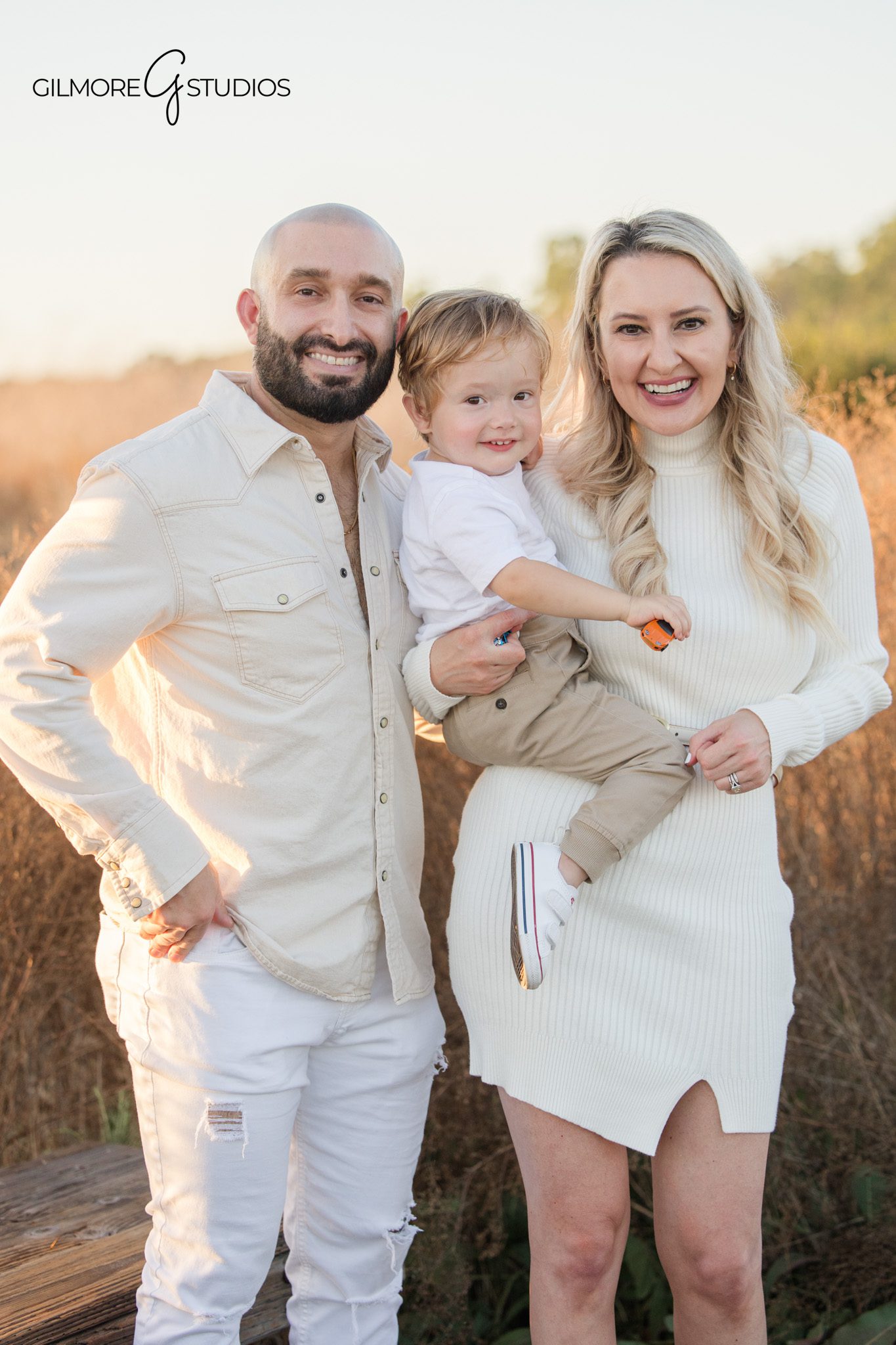 family photography Crystal Cove Newport Beach natural light portrait session
Newport Beach family portrait photography parents smiling with toddler outdoors
