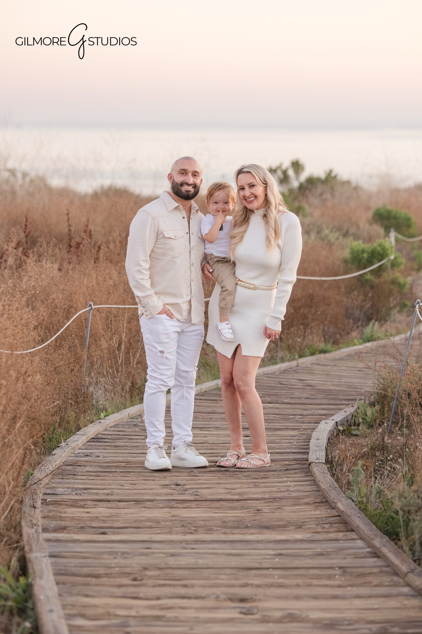 Newport Beach CA family portrait photography toddler held by parents
family photography Crystal Cove lifestyle portrait natural light session