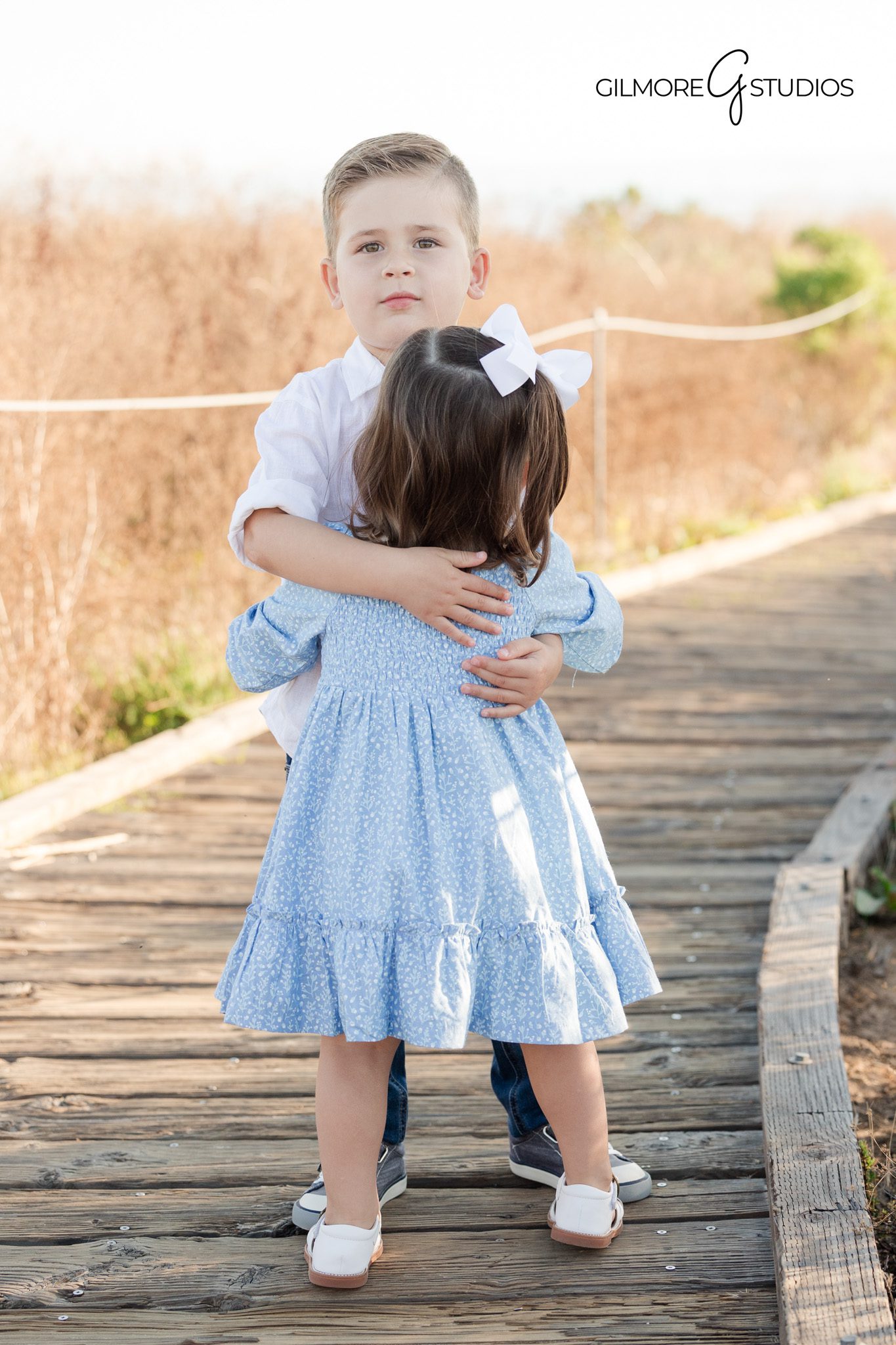 family photographer crystal cove boardwalk, orange county beach family photography candid moments