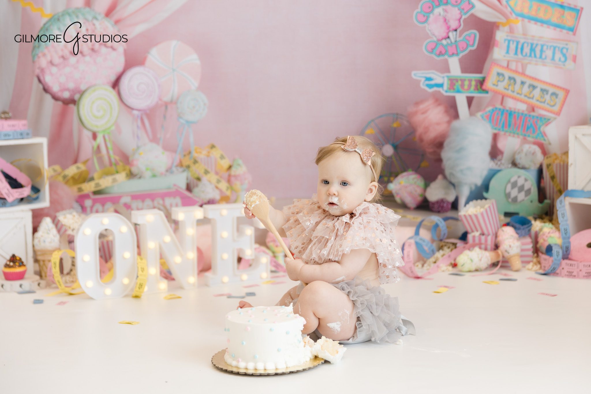 cake smash photography pastel carnival setup
orange county baby photographer first birthday session