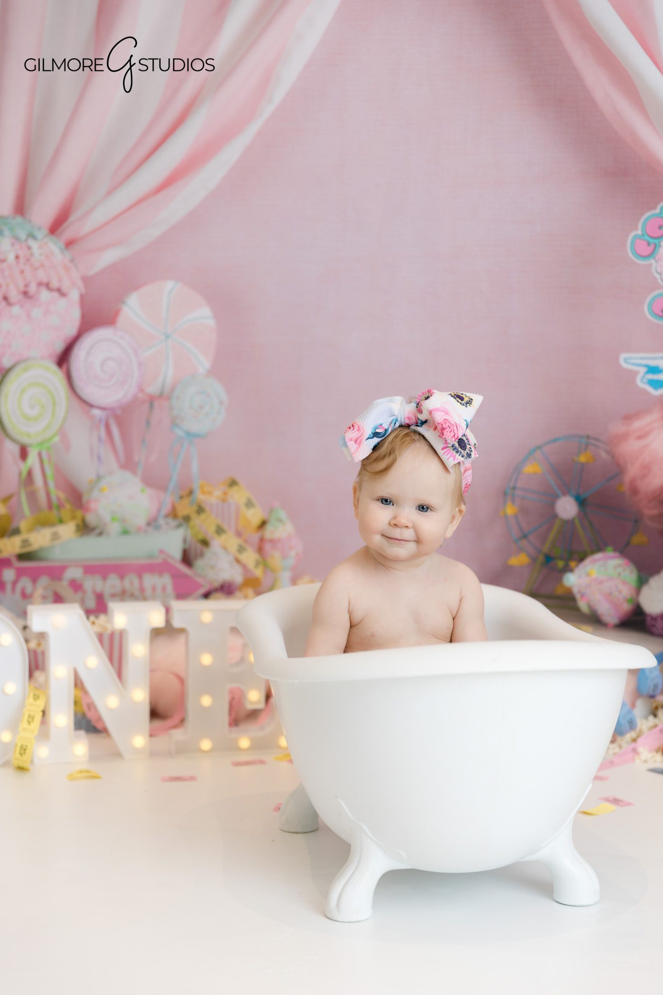cake smash photographer newport beach carnival theme
first birthday photography baby girl pastel carnival