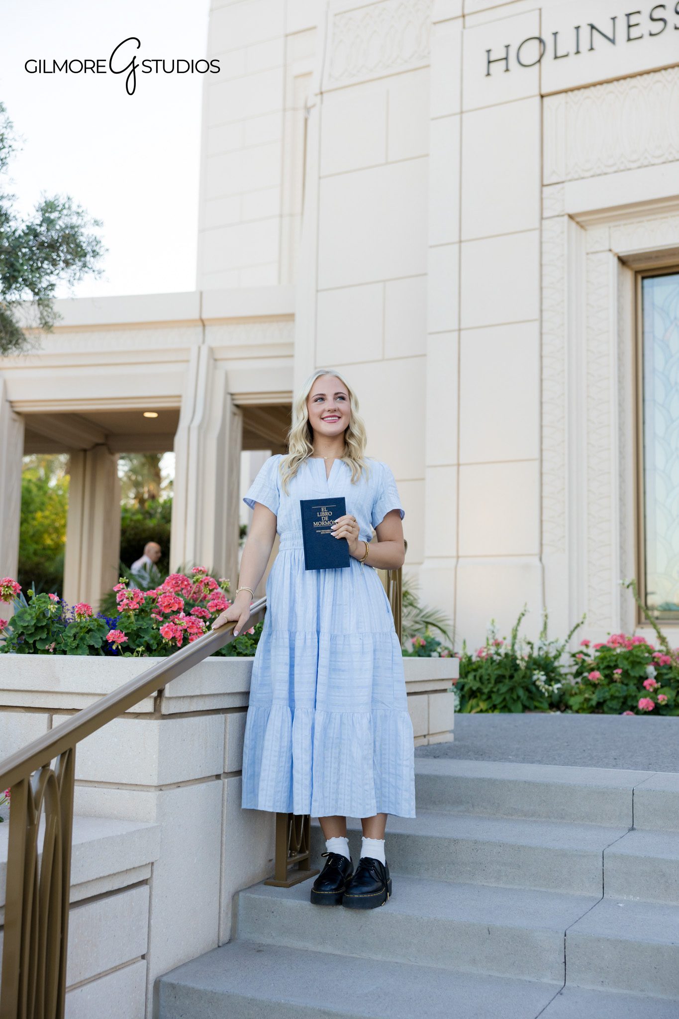 LDS missionary photographer Gilbert AZ female holding Book of Mormon smiling | Gilbert Arizona missionary portrait photography