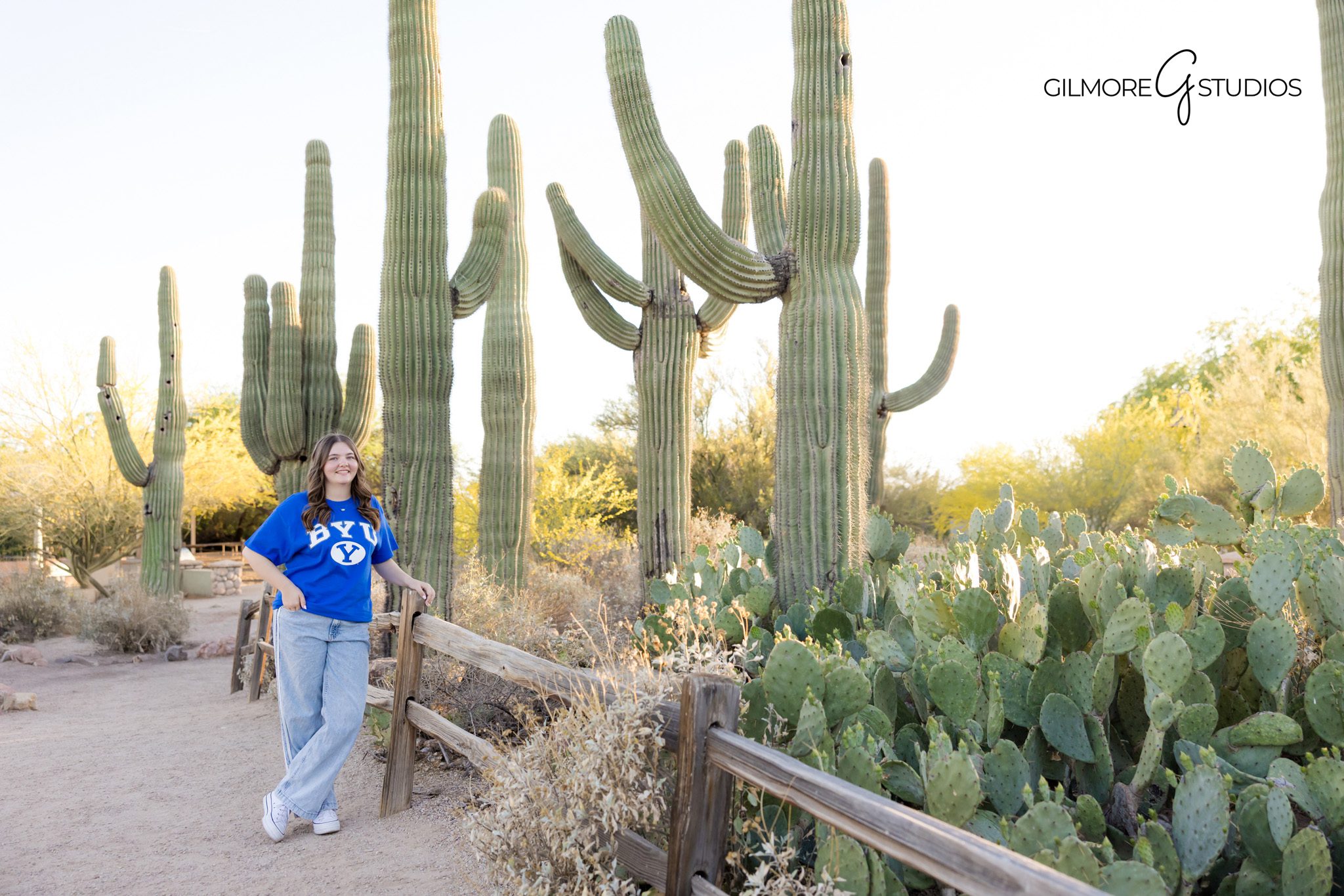 Senior girl posing near cactus Gilbert AZ natural light session
Gilbert Arizona senior photographer desert cactus portrait session