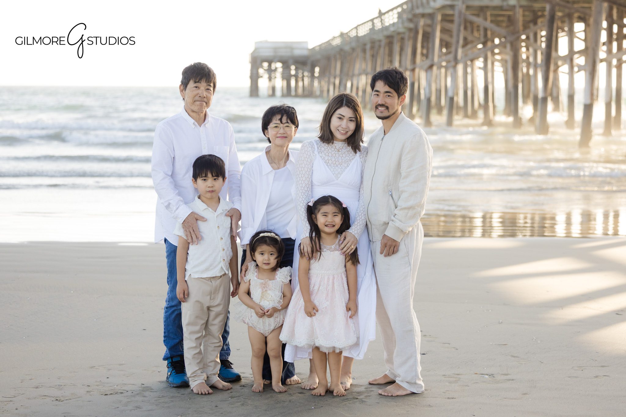 Newport Beach family photo at pier morning light
Family portrait at Newport Pier soft sunrise lighting