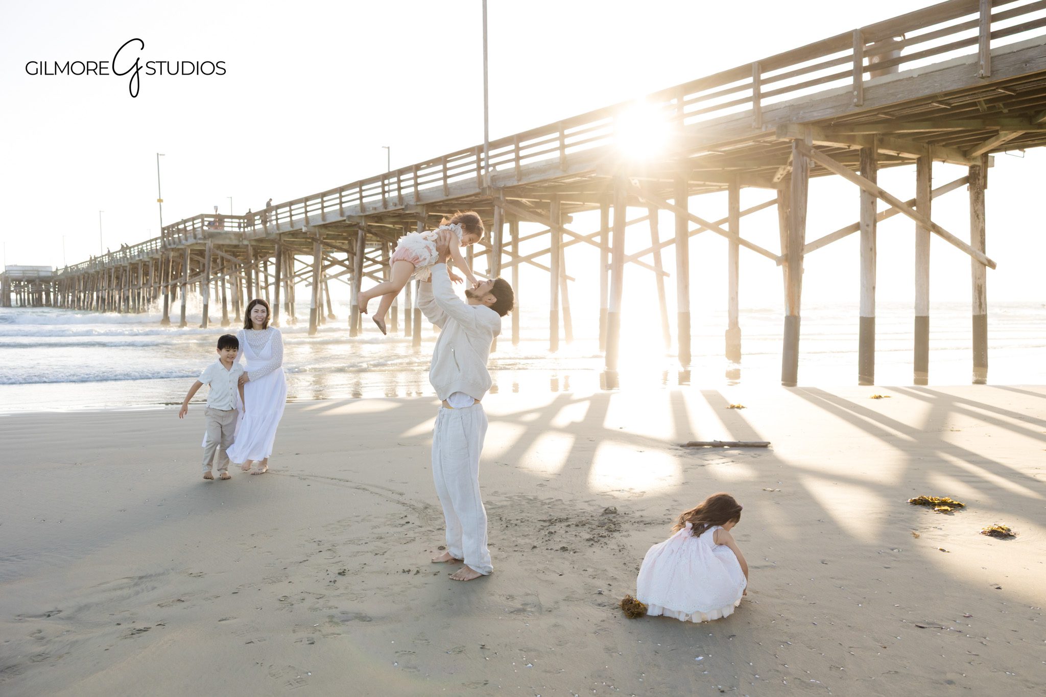Children playing during family beach session
Kids candid moment Newport Beach photoshoot