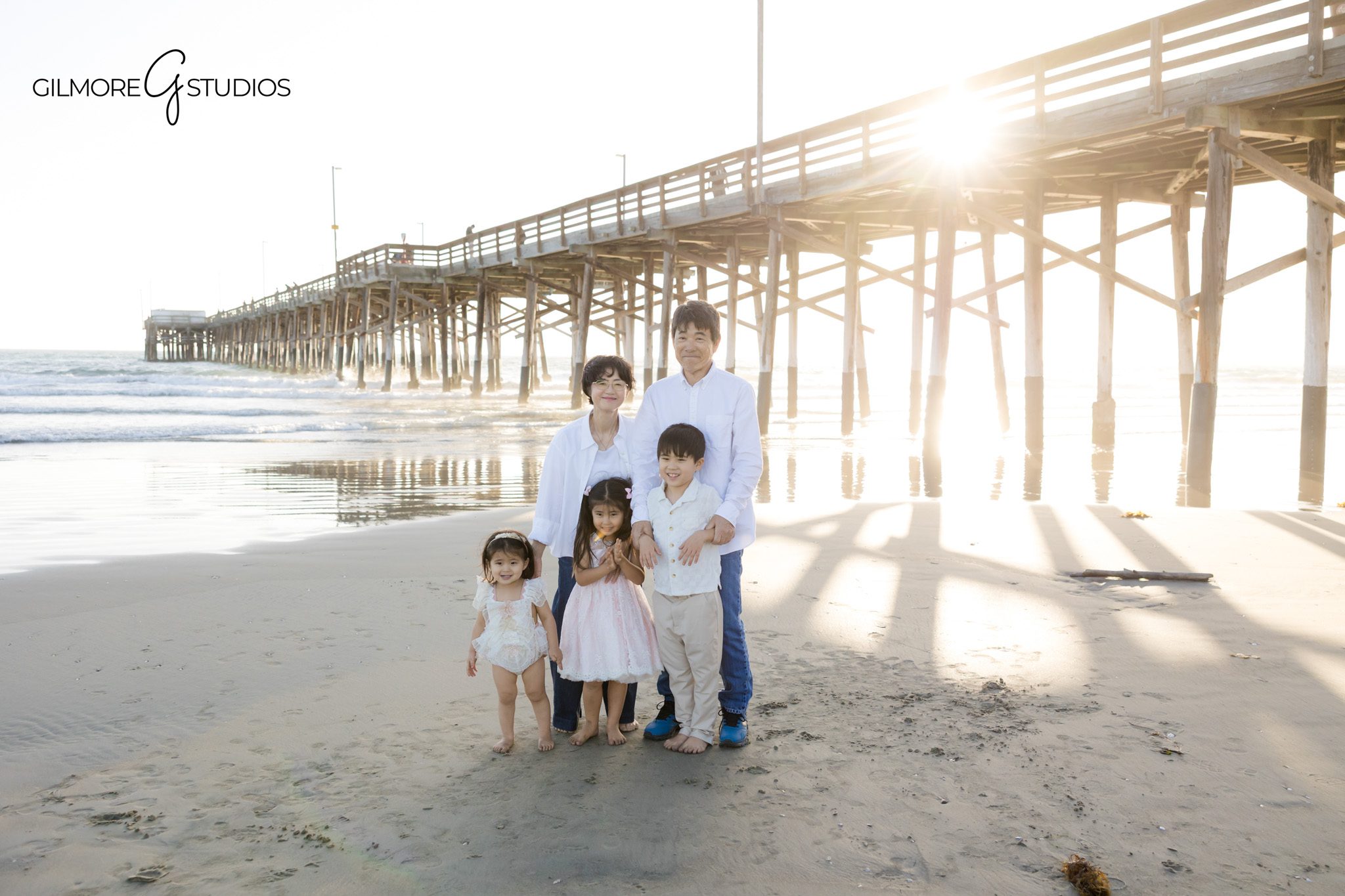 Family session kids natural interaction beach
Children smiling during beach family portraits