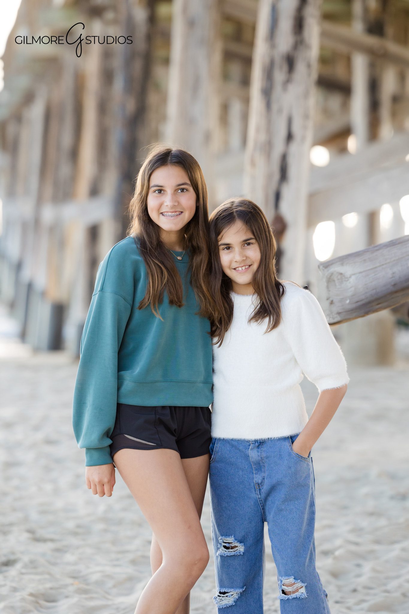 family portraits Newport Beach under pier shadows and textures
Newport Pier family photographer using soft shaded lighting beach photos