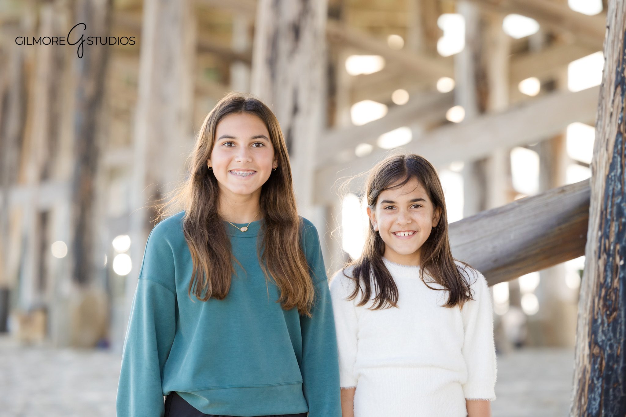 coastal lifestyle family photography Newport Beach pier setting
beach family photo session Newport California candid interaction