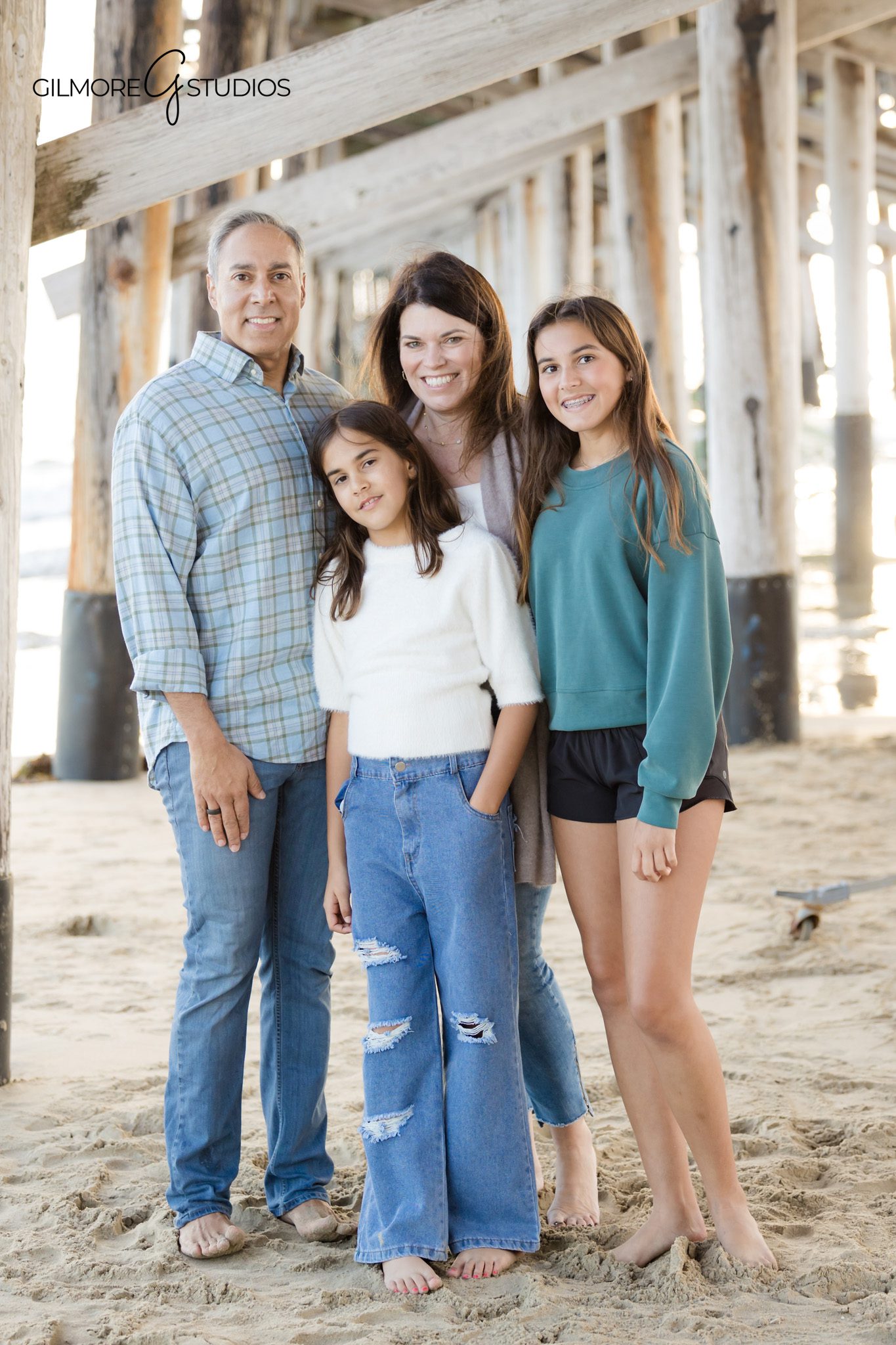 candid family photography Newport Beach kids playing in sand
Newport Pier family photographer capturing natural child moments
