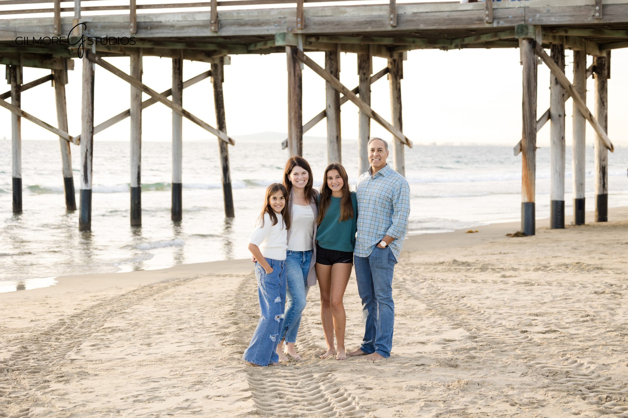 Newport Pier family photographer capturing beach family portraits in Newport Beach
Newport Beach family photography session at Newport Pier with ocean backdrop