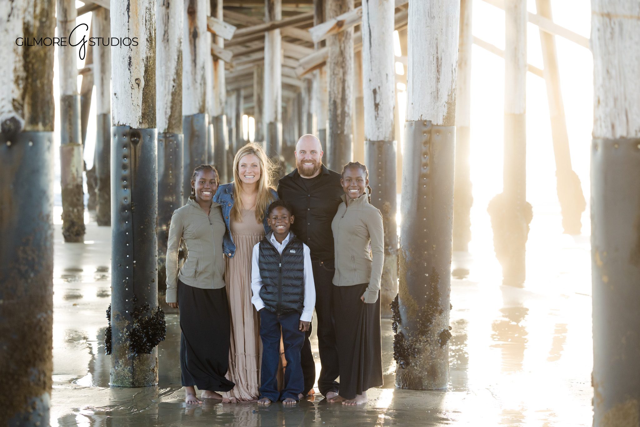 beach family photos Newport Beach children hugging smiling
coastal family photography California candid sibling interaction