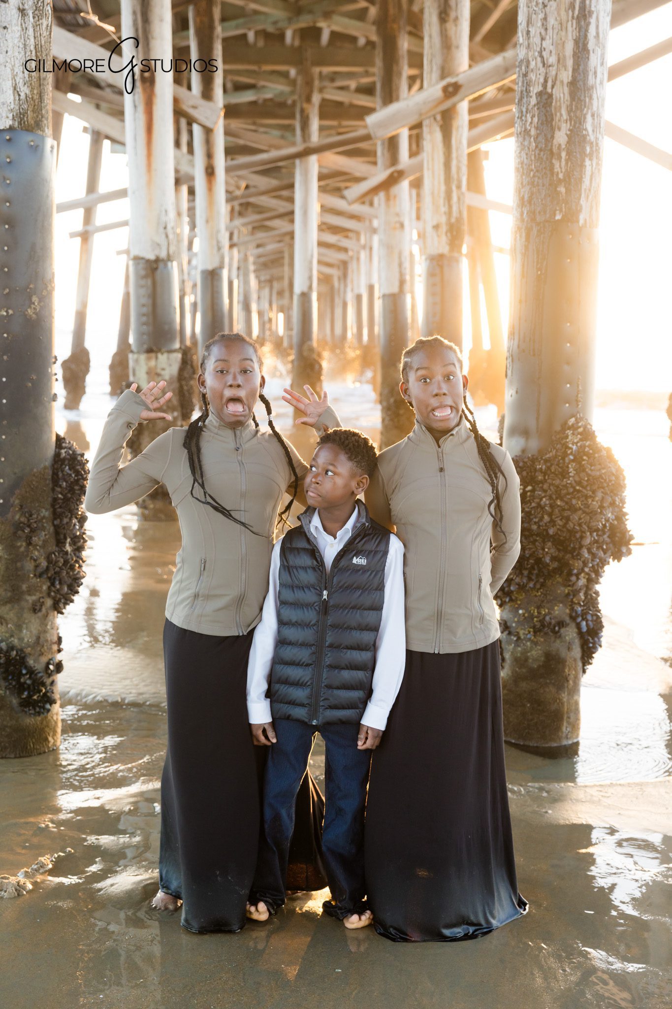 beach family photos Newport Beach children close up natural light
coastal family photography California kids portrait under pier