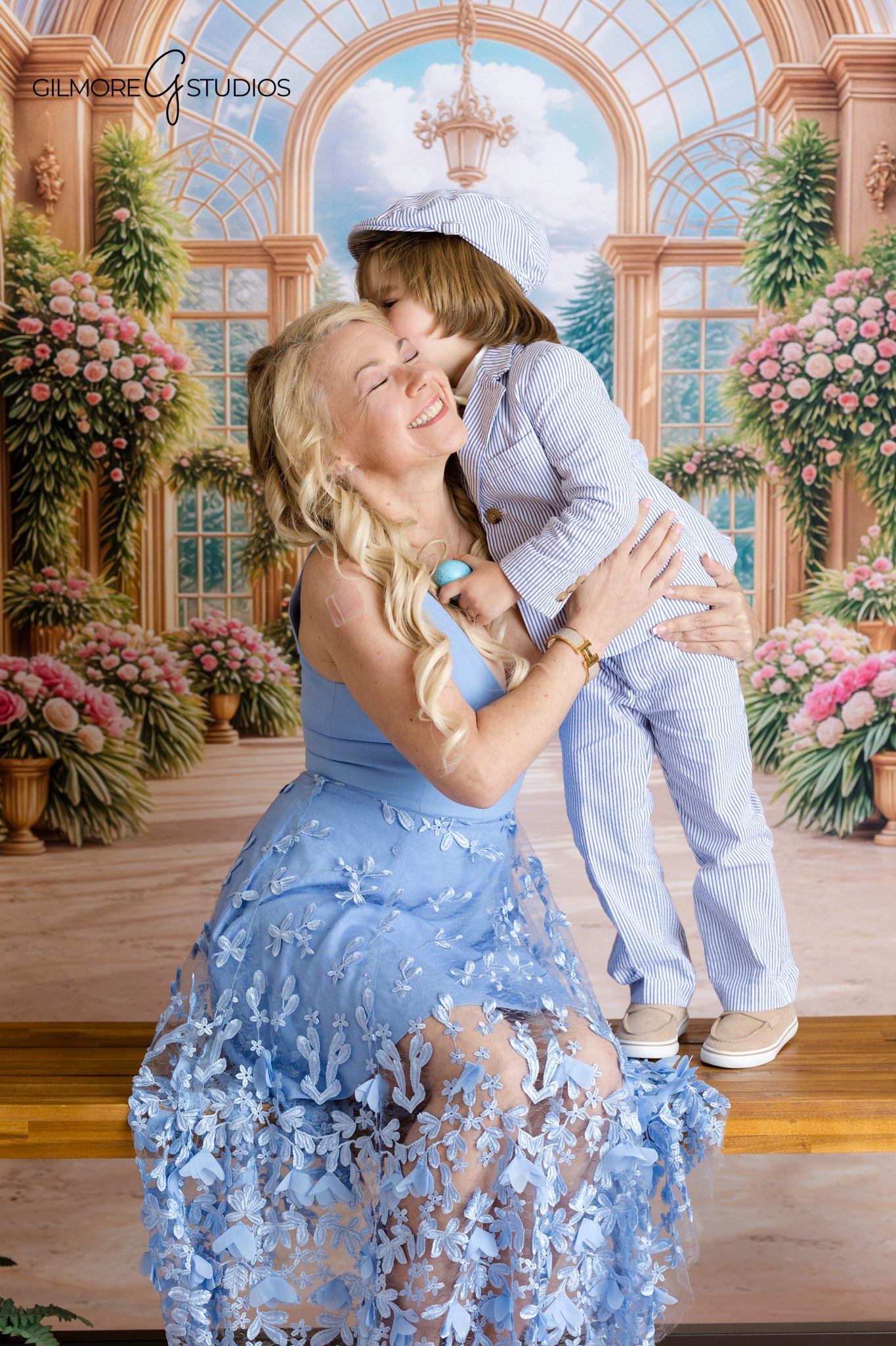 Newport Beach Easter mini sessions mom and child sitting on bench portrait
Easter family photos Newport Beach CA mother son floral backdrop