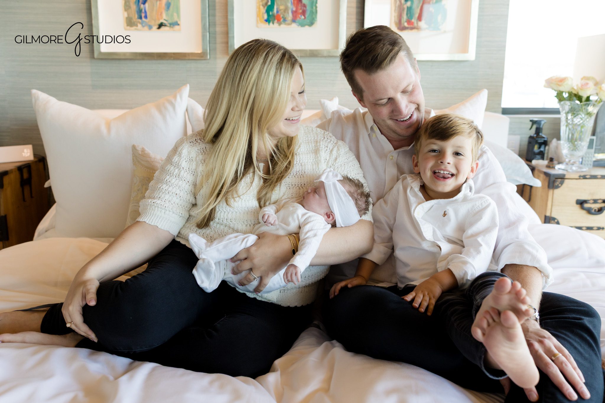 Gilbert AZ newborn lifestyle photographer family cuddling on bed
lifestyle newborn photography Gilbert Arizona parents and children together